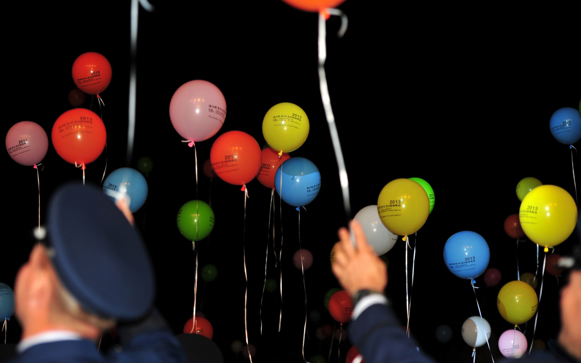 Distinguished military guests release “hope” balloons at the opening ceremony of the 10th Annual Korean-American Friendship Festival in the Songtan Entertainment District, Republic of Korea, Oct. 5, 2013. The balloons symbolized the hope that the strong relationship between U.S. Forces Korea personnel and their host countrymen would continue to flourish. (U.S. Air Force photo/Airman 1st Class Ashley J. Thum)