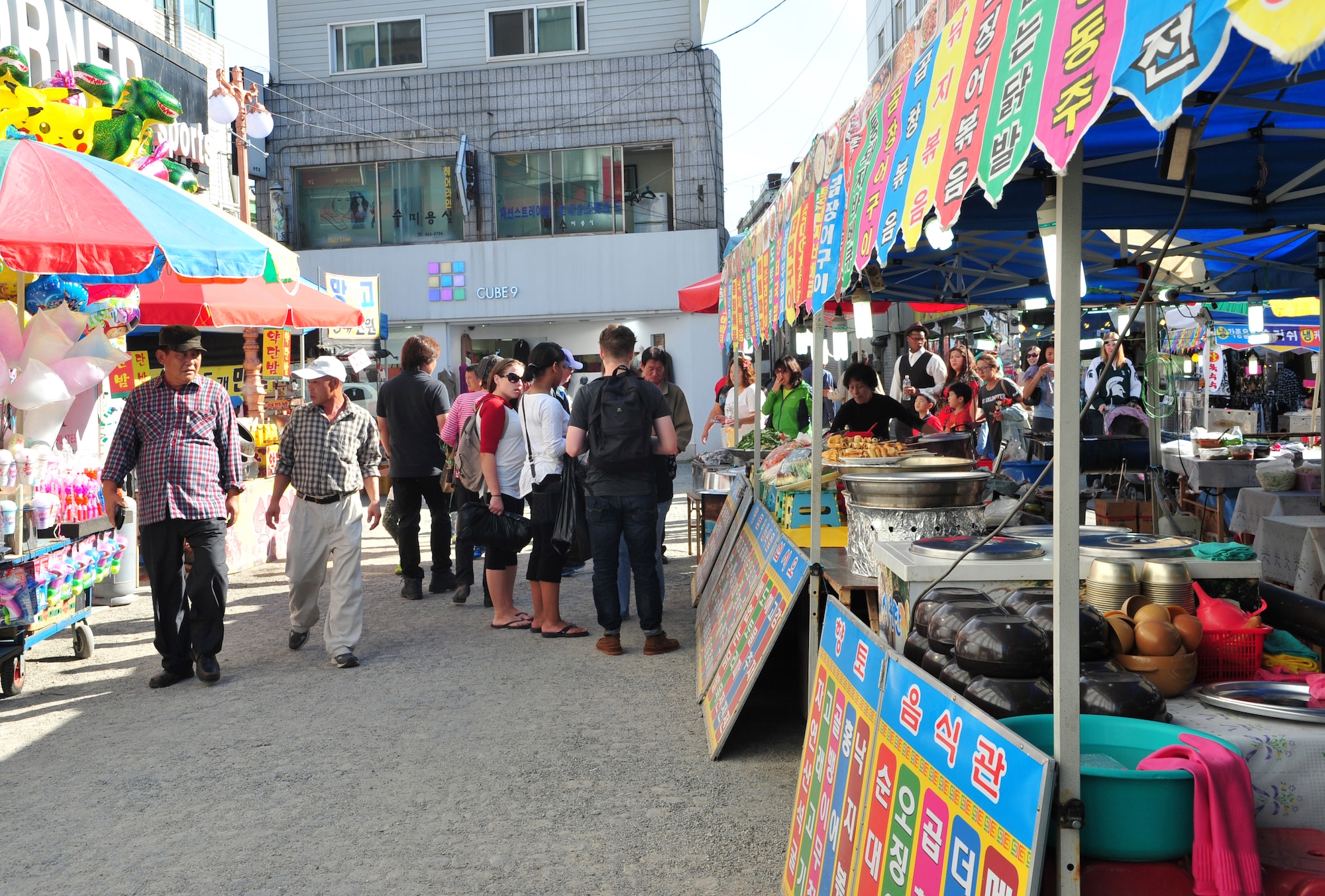 Americans and Koreans take in the sights during the 10th Annual Korean-American Friendship Festival in the Songtan Entertainment District, Republic of Korea, Oct. 5, 2013. The two-day event used the common threads of music, food and games to celebrate the rich history of and the bond between the two countries. (U.S. Air Force photo/Airman 1st Class Ashley J. Thum)