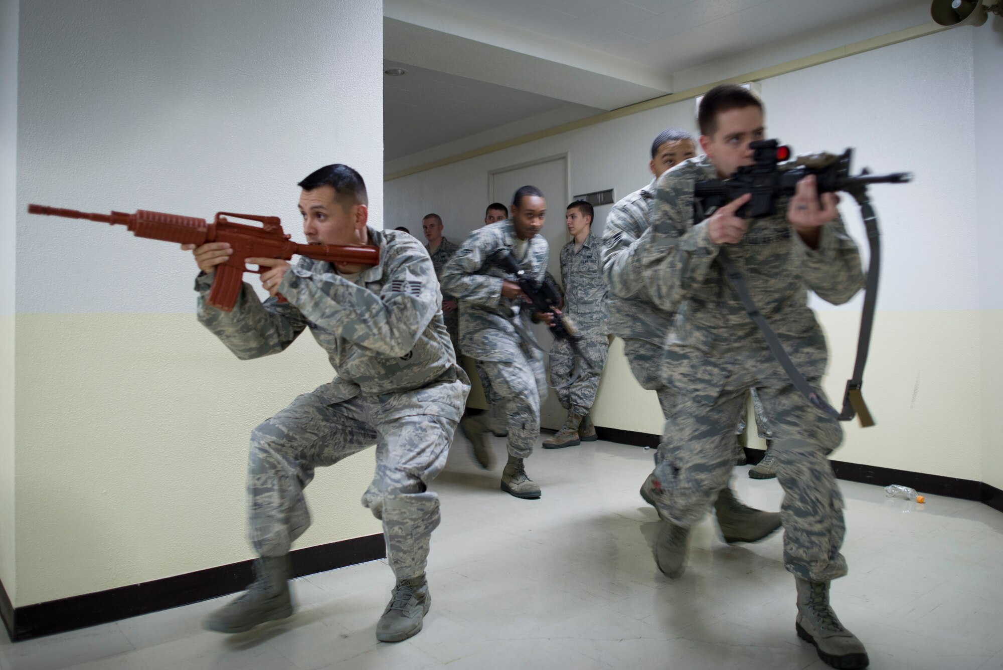 Airmen gain basic base defense skills from the 374th Security Forces squadron during augmentee training Oct. 8, 2013, at Yokota Air Base, Japan. The training was conducted as part of Readiness Week at Yokota, which is focusing on a number of readiness related tasks and enhancing the wing's ability to generate aircraft under various conditions. (U.S. Air Force photo by Staff Sgt. Stacy Moless/released)