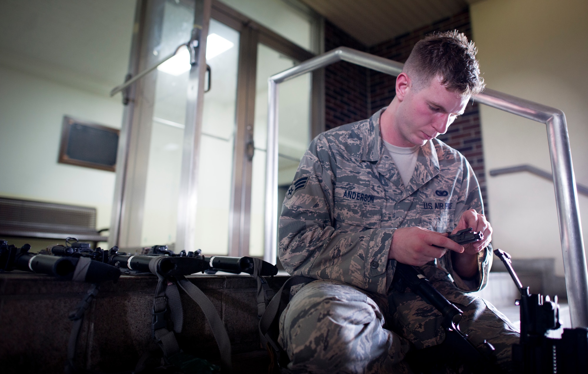Senior Airman Kurtis Anderson, 374th Security Forces squadron, system checks weapons during augmentee training Oct. 8, 2013, at Yokota Air Base, Japan. The training was conducted as part of Readiness Week at Yokota, which is focusing on a number of readiness related tasks and enhancing the wing's ability to generate aircraft under various conditions. (U.S. Air Force photo by Staff Sgt. Stacy Moless/released)