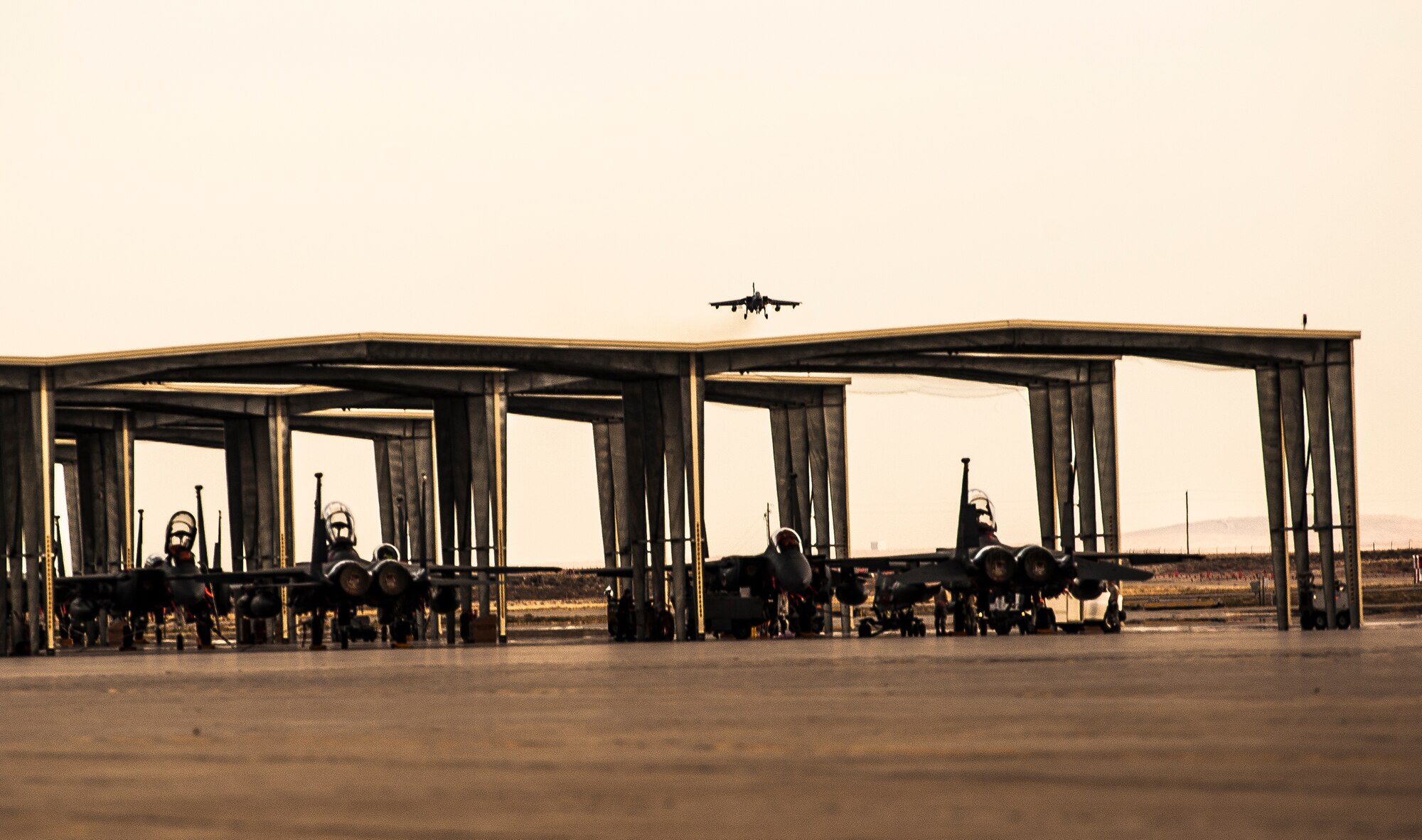 A German Air Force AG-51 Tornado lands at Mountain Home Air Force Base, Idaho, Oct. 7, 2013, during exercise Mountain Roundup 2013, a multinational combined-joint exercise which is part of the German Air Force Tornado Fighter Weapons Instructor Course Mission Employment Phase, scheduled to end here Oct. 16.  The aircraft seen in the foreground are U.S. Air Force F-15E Stike Eagles, assigned to the base, which is support Mountain Roundup in order to assist realistic training and bolster real-world employment of combat airpower. (U.S. Air Force photo by Master Sgt. Kevin Wallace/RELEASED)
