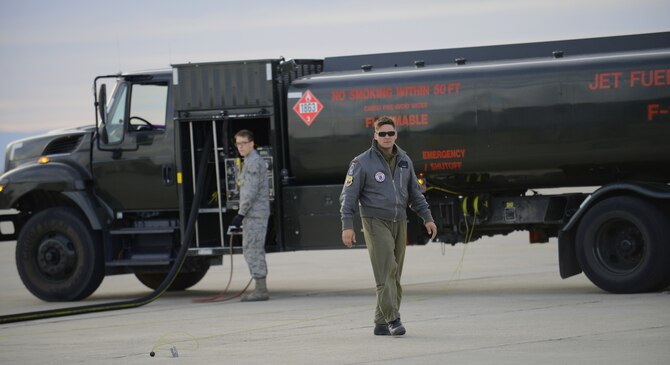 U.S. Air Force Airman 1st Class Aaron Dunn 366th Logistics Readiness Squadron fuels operator, operates his R-11 refueler Oct. 7, 2013, at Mountain Home Air Force Base, Idaho while a German Air Force maintainer walks by. The GAF currently has more than 10 AG-51 Tornados flying around the clock training missions for the Mountain Roundup exercise. (U.S. Air Force photo by Senior Airman Benjamin Sutton/RELEASED)