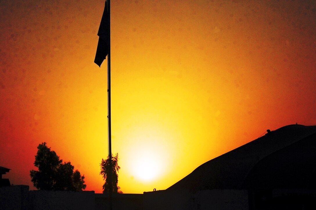 The sun sets over the 10th Combat Aviation Brigade's area of operations on Forward Operating Base Fenty in Afghanistan's Nangarhar province, Oct. 3, 2013, before a mission to move personnel.