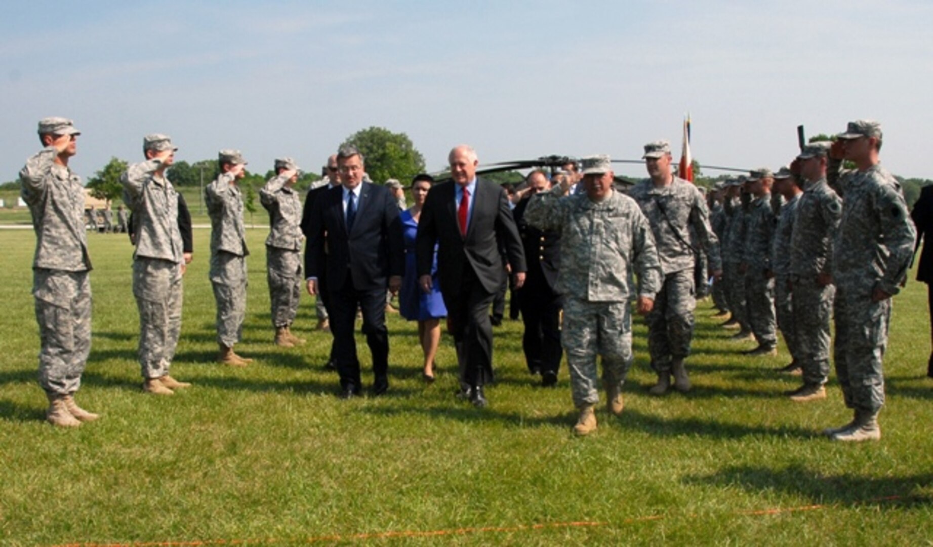 Polish President Bronislaw Komorowski visited Illinois Army National Guard Soldiers and five Polish officers who were conducting training May 20, 2012 at the Marseilles Training Center in Marseilles, Ill. Komorowski was accompanied by Illinois Gov. Pat Quinn and senior leaders of the Illinois National Guard, to include Army Maj. Gen. William L. Enyart, the adjutant general of the Illinois National Guard. Komorowski presented Quinn, Enyart, and 13 other Illinois Guard members with the Commander's Cross of the Order of Merit of the Republic of Poland, an honor that is bestowed upon foreigners for distinguished contributions to international cooperation with the nation of Poland.