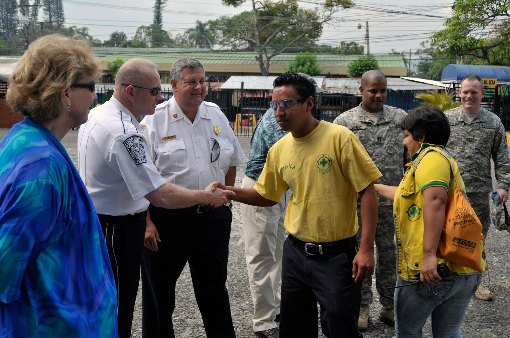 As part of the National Guard Bureau's State Partnership Program, a group of New Hampshire National Guard members and N.H. civil emergency response leaders greet members of the Comandos del Salvamento Green Cross outside the Republica de El Salvador en la American Central, Ministerio de Governacion building, as they tour various emergency response centers in San Salvador, El Salvador, May 10, 2012.