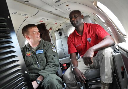 Air Force Maj. David Brown, from the Florida Air National Guard's 125th Fighter Wing, discusses the equipment on his unit's RC-26B Metroliner with Earl Bowen from the Regional Security System in Jacksonville, Fla. March 14, 2012. The three-day informational exchange was part of Florida's ongoing partnership with the RSS through the National Guard's State Partnership Program, and centered around repairs, upgrades and training on the RC-26 fixed wing aircraft.