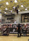 A BMX rider backflips over a school administrator at Mount Vernon High School, Fortville, Ind., during the first performance of the RS Indianpolis 2013 ASA Tour on Sep. 30. The ASA tour consists of demonstartions using extreme sports with an anti-bullying message.