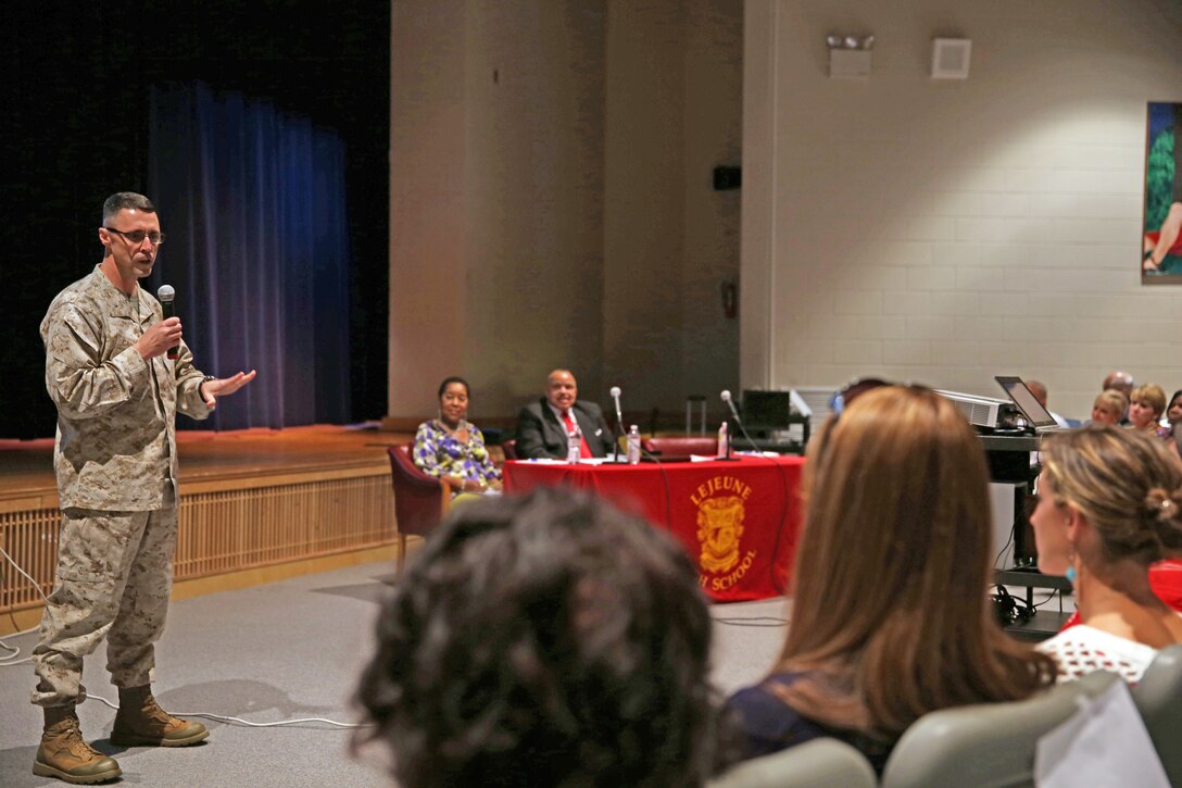 Brig. Gen. Robert F. Castellvi, Marine Corps Base Camp Lejeune commanding general, talks with parents, students and school employees about school-related issues during a town hall meeting at the Lejeune High School auditorium, Oct. 3. Dr. Harriet Hunter-Boykin, Camp Lejeune Dependents Schools assistant superintendent, and Dr. Aldridge A. Boone, CLDS superintendent, were also on-hand to answer questions about the schools.