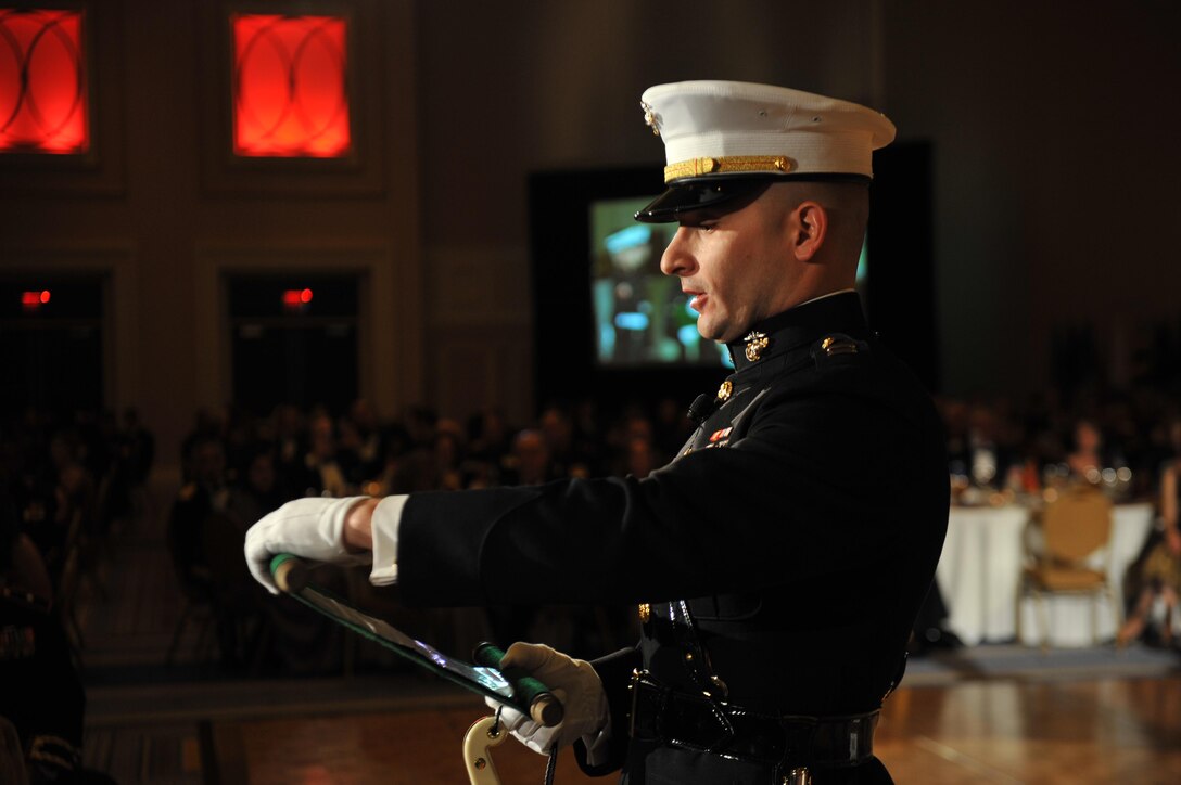 Capt. Peter Combe, from the Staff Judge Advocate office, reads Gen. John Lejeune’s birthday message aloud during a Marine Corps birthday ball at the Gaylord National Hotel and Convention Center. The birthday ball is an opportunity for Marines to enjoy the traditions and customs passed down through Marine Corps history.