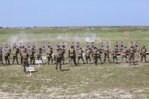 Philippine marines and U.S. Marines with Kilo Company, 3rd Battalion, 3rd Marine Regiment, assigned to the 3rd Marine Expeditionary Brigade, III Marine Expeditionary Force, engage targets using M16A4 rifles while conducting a stress shoot during Amphibious Landing Exercise (PHIBLEX) 14 at Naval Station Leovigildo Gantioqui in San Antonio, Zambales province, Philippines, Oct. 6, 2013. A stress shoot incorporated physical exercises before shooting to increase the service members' fatigue in order to simulate combat conditions. PHIBLEX is a bilateral training exercise designed to improve the interoperability, readiness and professional relationships between the U.S. Marine Corps and partner nations.