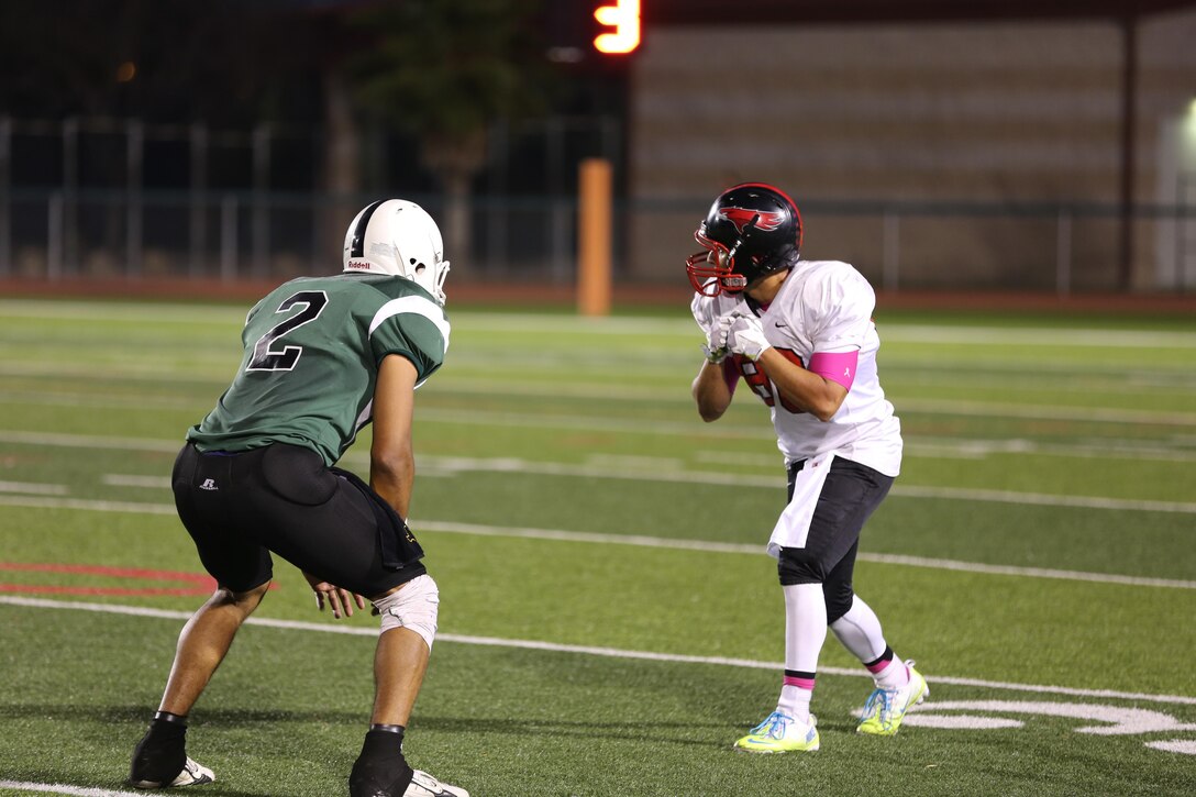 Jeremy Rodriguez, Falcon's wide reciever, takes a stance waiting for the snap against the 1st Radio Battalion Freqs at Paige Field House aboard Marine Corps Base Camp Pendleton, Calif.,Oct. 7. The Falcons recieved their first loss against the Freqs moving their record to 5-1.