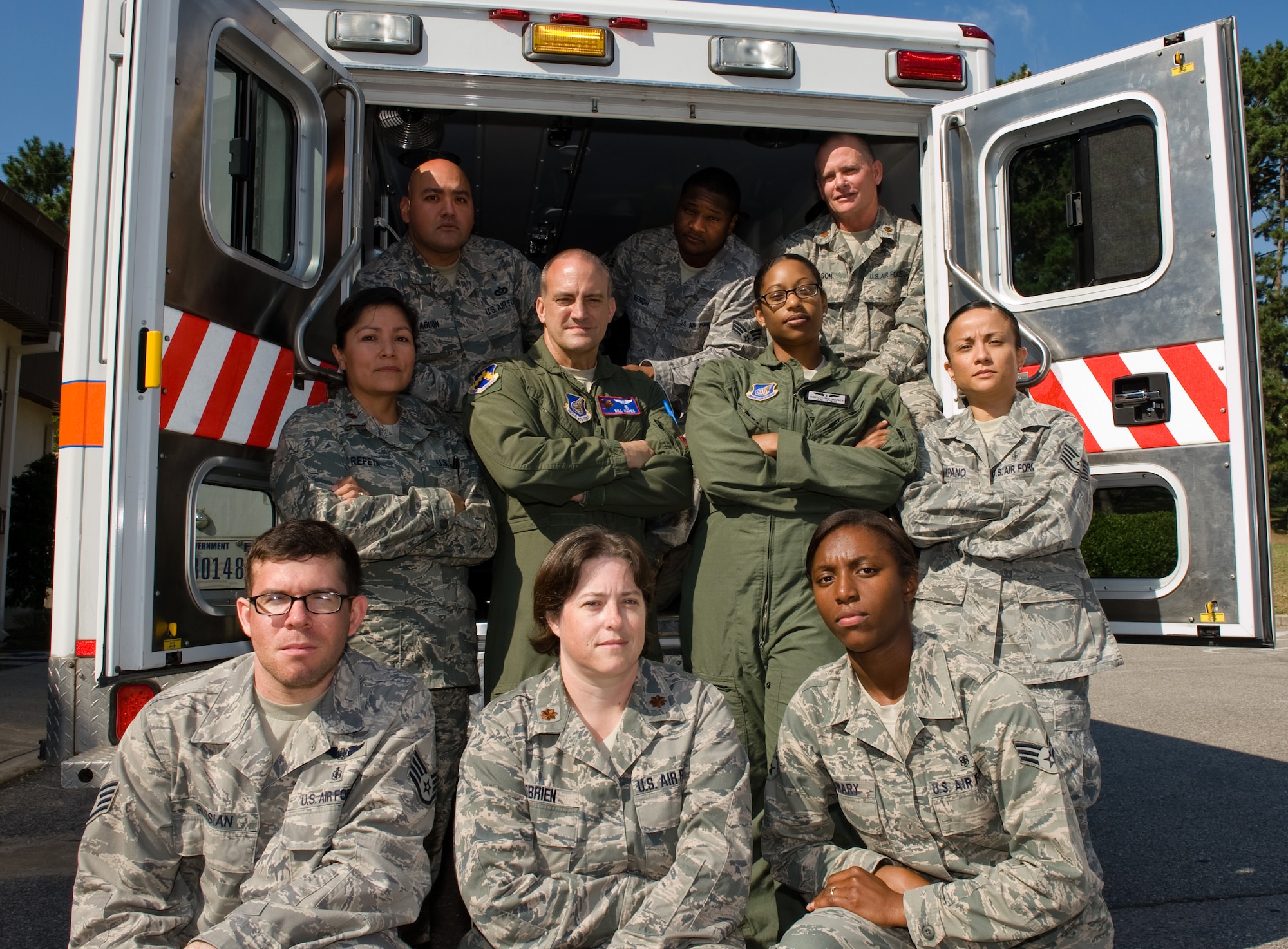 Wolf Pack medics pose for a photo at Kunsan Air Base, Republic of Korea, Oct. 9, 2013. The Wolf Pack provided lifesaving procedures for two civilians rescued at sea. The U.S. Navy and Air Force coordinated efforts to ensure the safe transfer of the patients to a local Korean hospital. (U.S. Air Force photo by Senior Airman Armando A. Schwier-Morales/Released) 