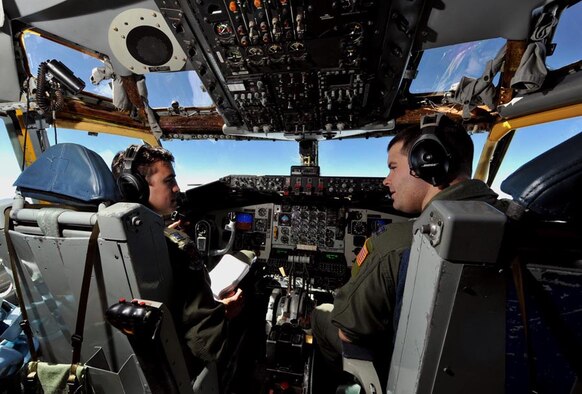 Capts. Mike Burns and Scott Huntley, 350th Air Refueling Squadron pilots, operate KC-135 Stratotaker during air refueling mission Oct. 4, 2013 over mid-west skies. Burns is a Rocklin, Calif., native and Huntley is a Fort Lauderdale, Fla., native. Despite a week of partial government shut-down, McConnell’s active duty flying operations continued as scheduled, helping directly support air mobility, airlift and national security. (U.S. Air Force photo/Staff Sgt. Jess Lockoski) 

