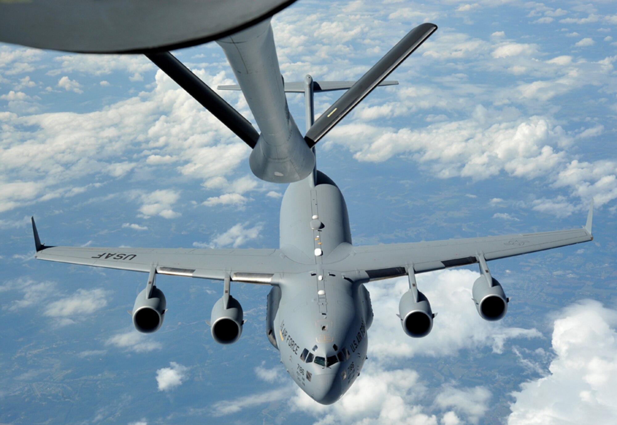A C-17 Globemaster III from the 437th Airlift Wing, Joint Base Charleston, S.C., approaches the boom of a KC-135 Stratotanker from the 22nd Air Refueling Wing, McConnell Air Force Base Kan. Oct. 4, 2013 during an air refueling mission over Kentucky. Air Mobility Command’s fleet of aircraft work together to provide rapid, global mobility for America’s armed forces. Depending on the aircraft model and mission requirements, McConnell AFB’s tankers can hold more than 170,000 pounds of fuel for refueling operations.  (U.S. Air Force photo/Staff Sgt. Jess Lockoski) 