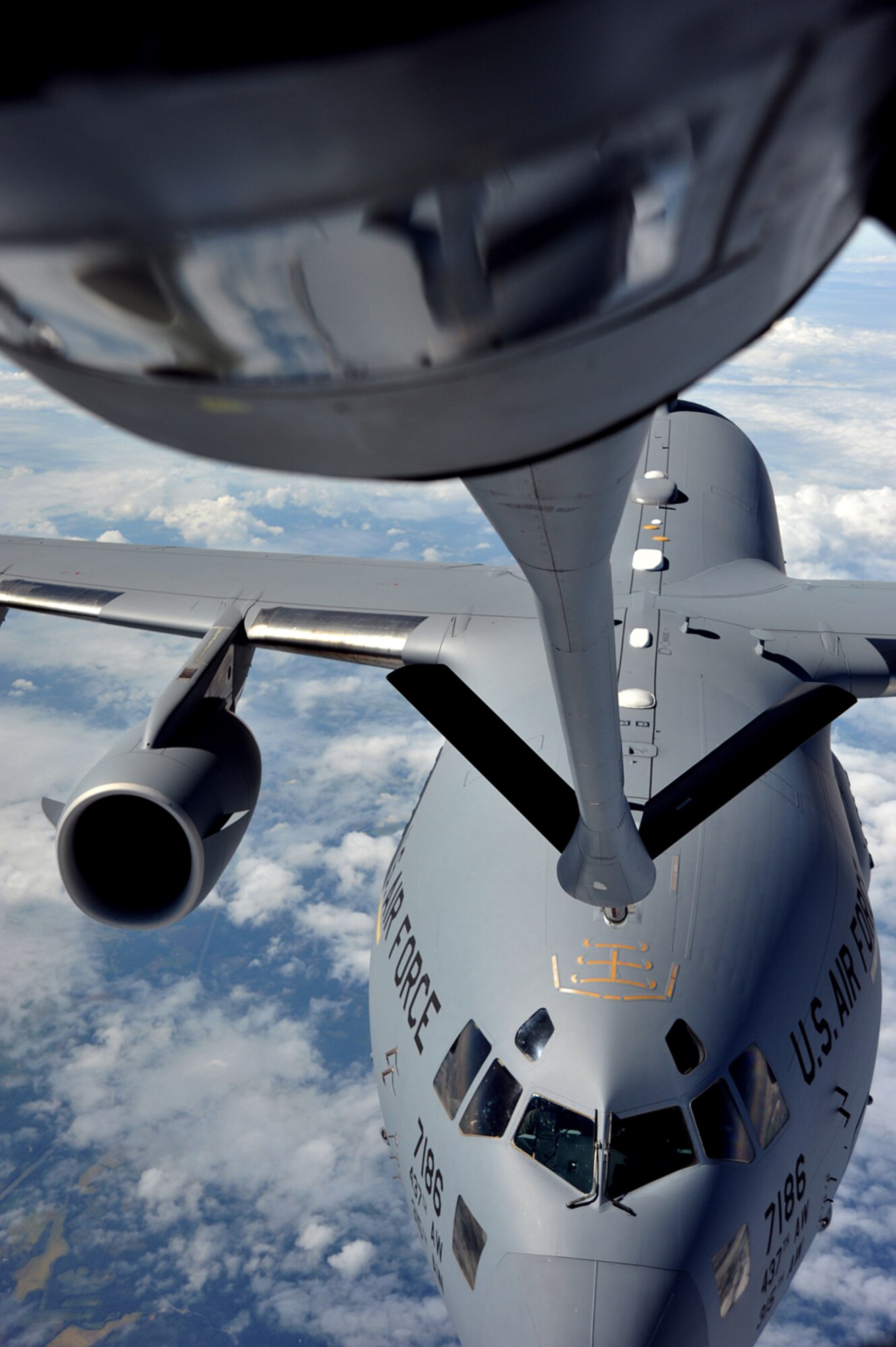 A C-17 Globemaster III from the 437th Airlift Wing, Joint Base Charleston, S.C., advances to make contact with a KC-135 Stratotanker from the 22nd Air Refueling Wing, McConnell Air Force Base, Kan., Oct. 4, 2013 during a refueling mission over Kentucky. Air refueling training missions keep Airmen from McConnell’s four flying squadrons proficient in all essential aspects of air-to-air refueling, helping extend global reach for American and coalition aircraft. (U.S. Air Force photo/Staff Sgt. Jess Lockoski) 
