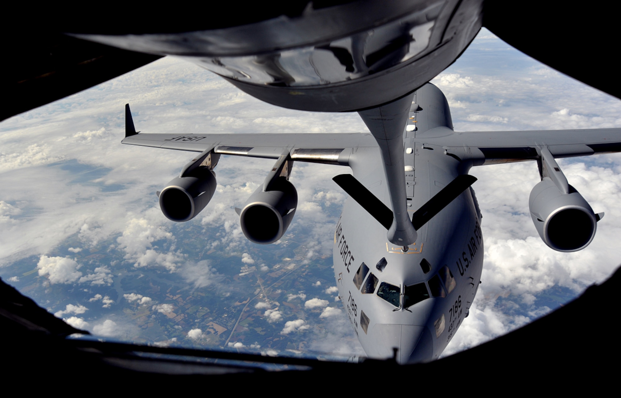 A C-17 Globemaster III from the 437th Airlift Wing, Joint Base Charleston, S.C., makes contact with a KC-135 Stratotanker from the 22nd Air Refueling Wing, McConnell Air Force Base, Kan., Oct. 4, 2013 during a refueling mission over Kentucky. Depending on the aircraft model and mission requirements, McConnell AFB’s tankers can hold more than 170,000 pounds of fuel for refueling operations. (U.S. Air Force photo/Staff Sgt. Jess Lockoski) 