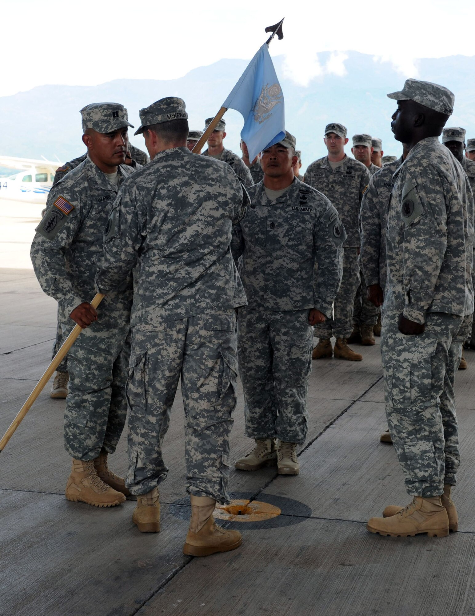 U.S. Army Capt. Dan Lozano accepts the Headquarters and Supply Company guidon from Lt. Col. Alan McKewan, commander, Joint Task Force-Bravo Army Forces Battalion.  Lozano assumed command of the HSC in a ceremony held at Soto Cano Air Base, Oct. 9, 2013.  He replaces outgoing commander, U.S. Army Capt. Ballah Howard.  

The HSC provides forward command and control, bulk fuel distribution, tactical transportation support, water purification, aerial delivery and ammunition support for Joint Task Force-Bravo.  The company is comprised of Air Force, Army, and Navy personnel.  All the services work together to accomplish the company's diverse mission.  (Photo by Martin Chahin)