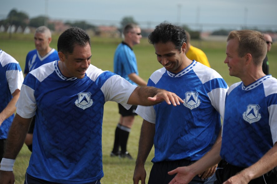 Students from Air War College celebrate their win over Air Command Staff College in a soccer match Force Base, Oct. 8. The race was part of a 2-day competition between the academic powerhouses compiling of approximately 20 events, both scholastic and athletic. (U.S. Air Force photo by Airman 1st Class William Blankenship)