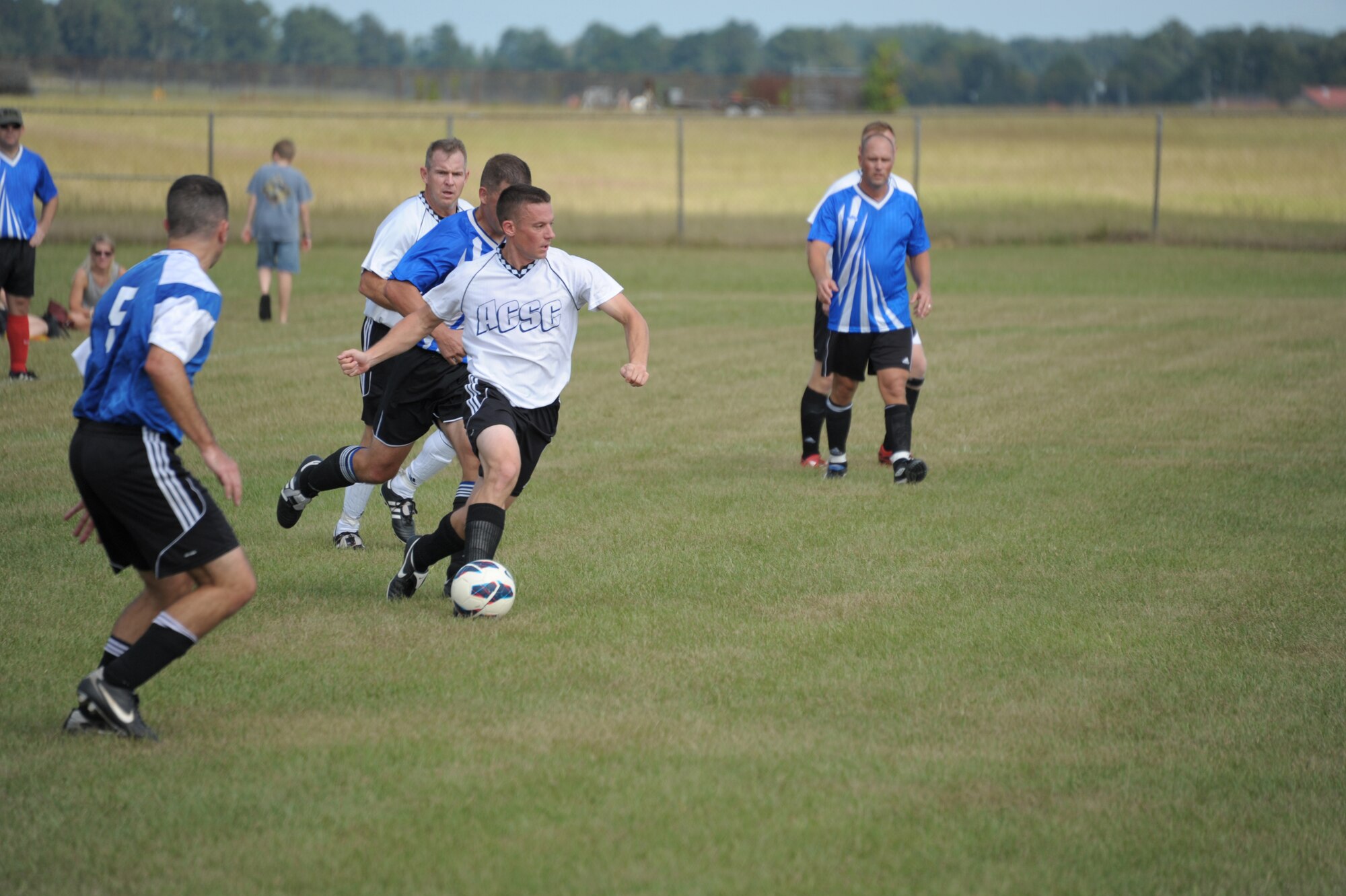 Students from Air War College and Air Command Staff College compete in a soccer match on Maxwell Air Force Base, Oct. 8. The game was part of a 2-day competition between the academic powerhouses compiling of approximately 20 events, both scholastic and athletic. (U.S. Air Force photo by Airman 1st Class William Blankenship)