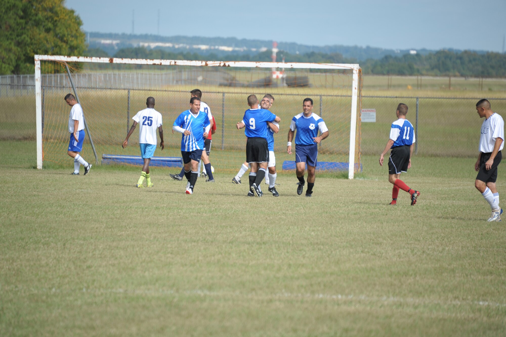 Students from Air War College celebrate a goal during their soccer game against Air Command and Staff College on Maxwell Air Force Base, Oct. 8. The game was part of a 2-day competition between the academic powerhouses compiling of approximately 20 events, both scholastic and athletic. (U.S. Air Force photo by Airman 1st Class William Blankenship)