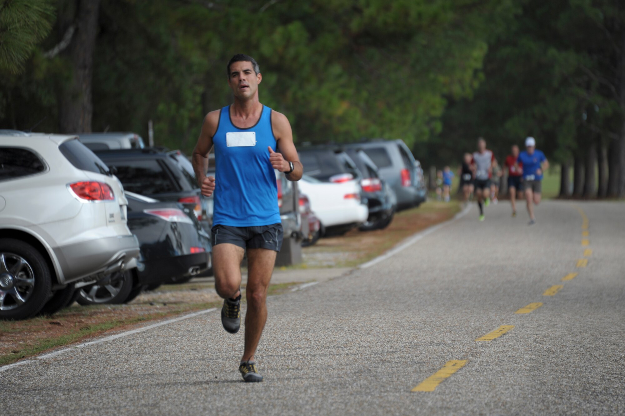 A student from Air Command and Staff College competes in a 5K race on Maxwell Air Force Base, Oct. 8. The race was part of a 2-day competition between ACSC and Air War College, compiling of approximately 20 events, both scholastic and athletic. (U.S. Air Force photo by Airman 1st Class William Blankenship)