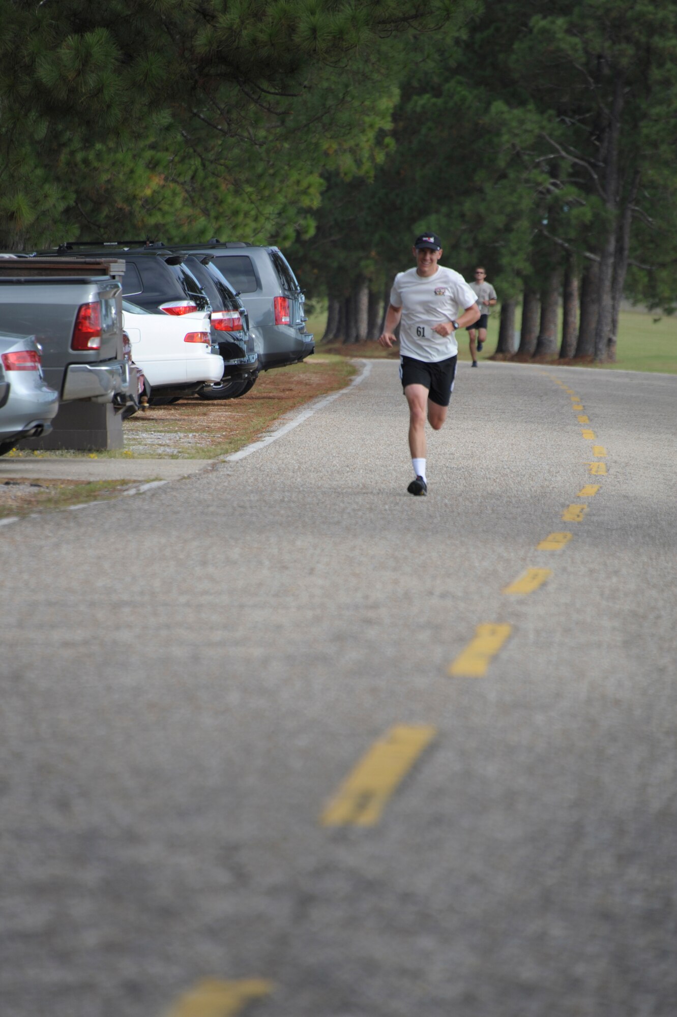 Maj. Shane Rogers, student from Air Command and Staff College, competes in a 5K race on Maxwell Air Force Base, Oct. 8. The race was part of a 2-day competition between ACSC and Air War College, compiling of approximately 20 events, both scholastic and athletic. (U.S. Air Force photo by Airman 1st Class William Blankenship)