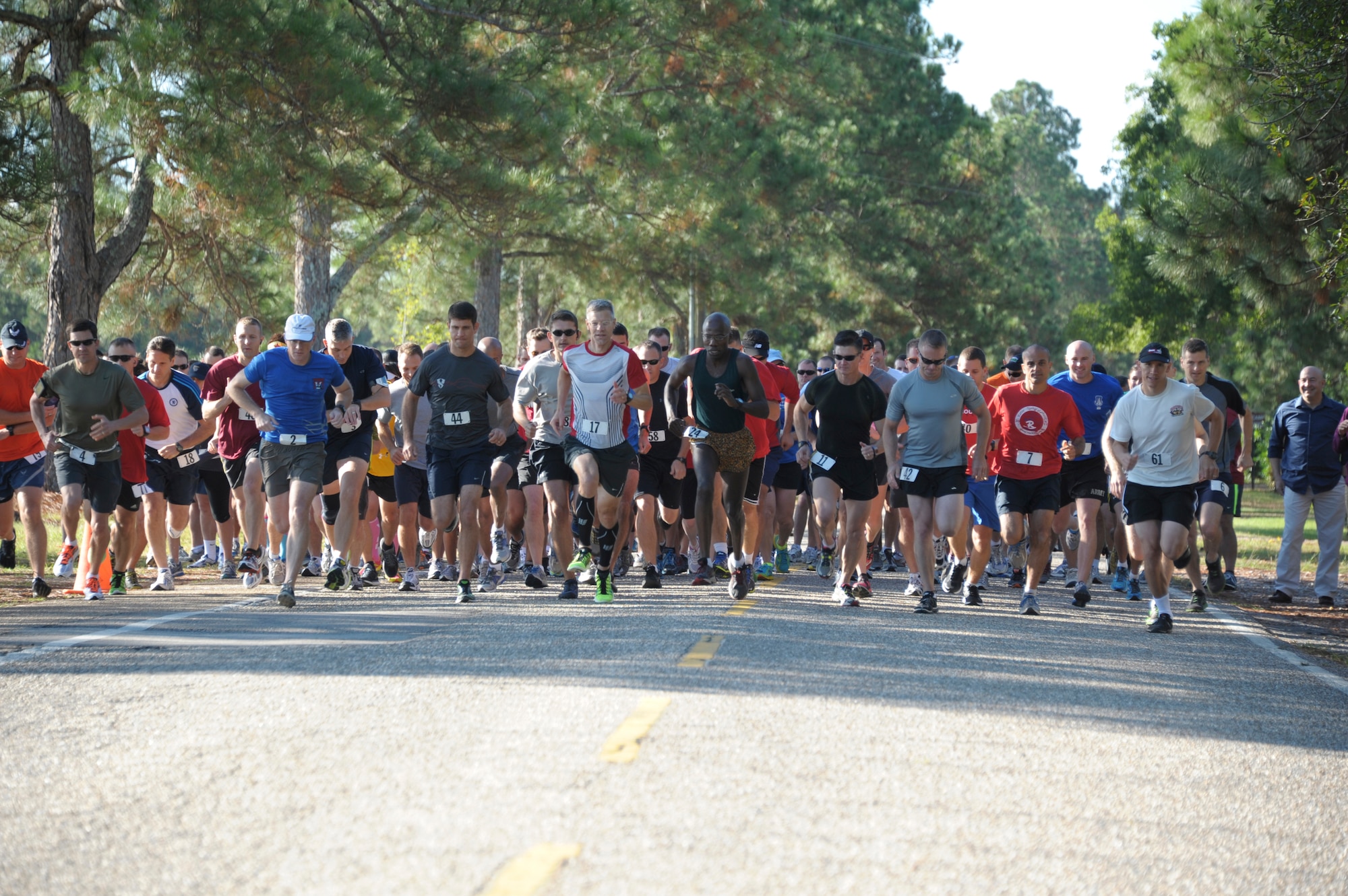 Students from Air War College and Air Command Staff College compete in a 5K race on Maxwell Air Force Base, Oct. 8. The race was part of a 2-day competition between the academic powerhouses compiling of approximately 20 events, both scholastic and athletic. (U.S. Air Force photo by Airman 1st Class William Blankenship)