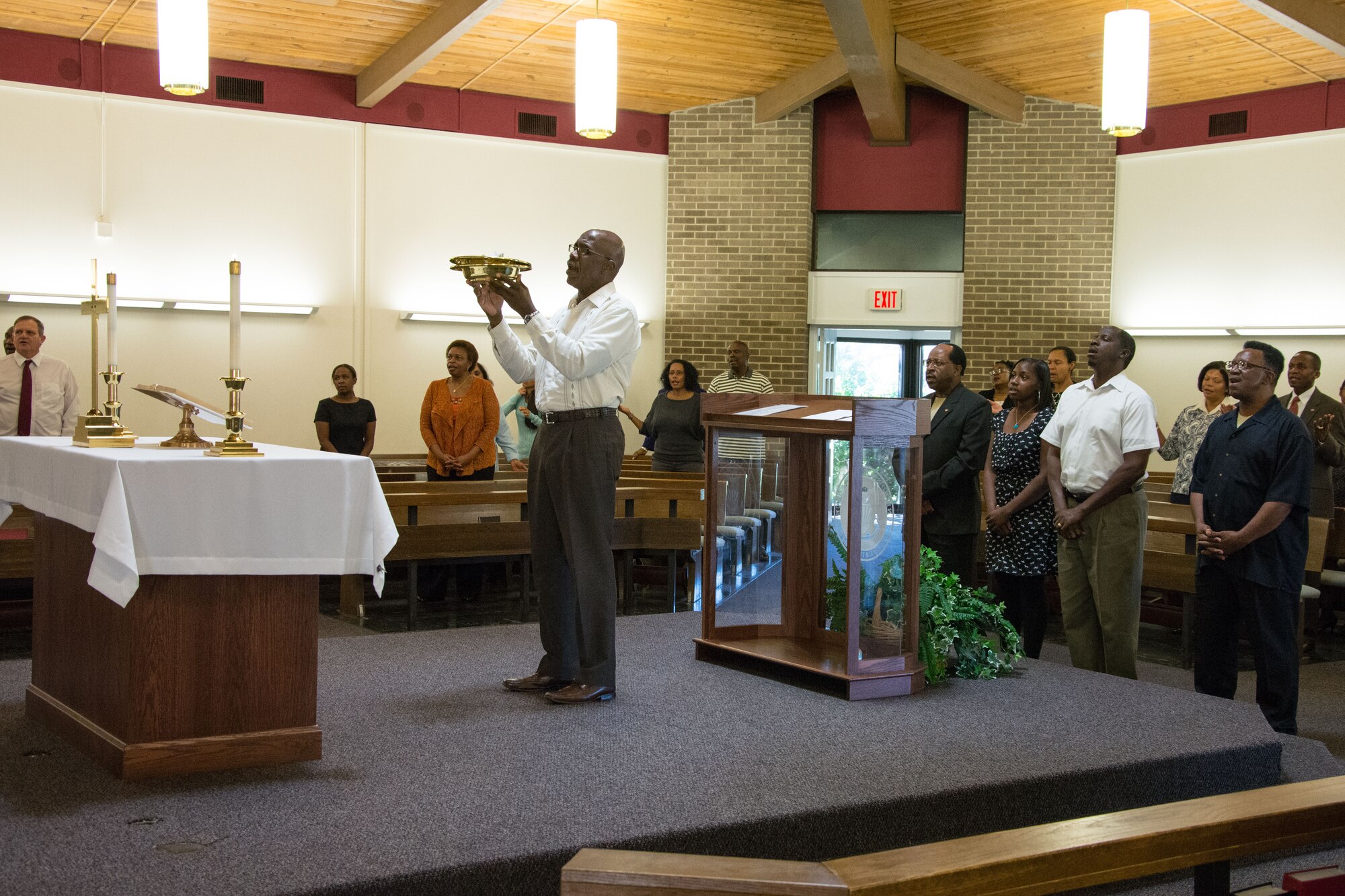 Members of the Gospel service congregation pray during the Gospel service Sept. 22, 2013, Scott Air Force Base, Ill. The Gospel service is one of a number of religious services offered by the 375th Air Mobility Wing chapel. (U.S. Air Force photo/Staff Sgt. Jonathan Fowler)