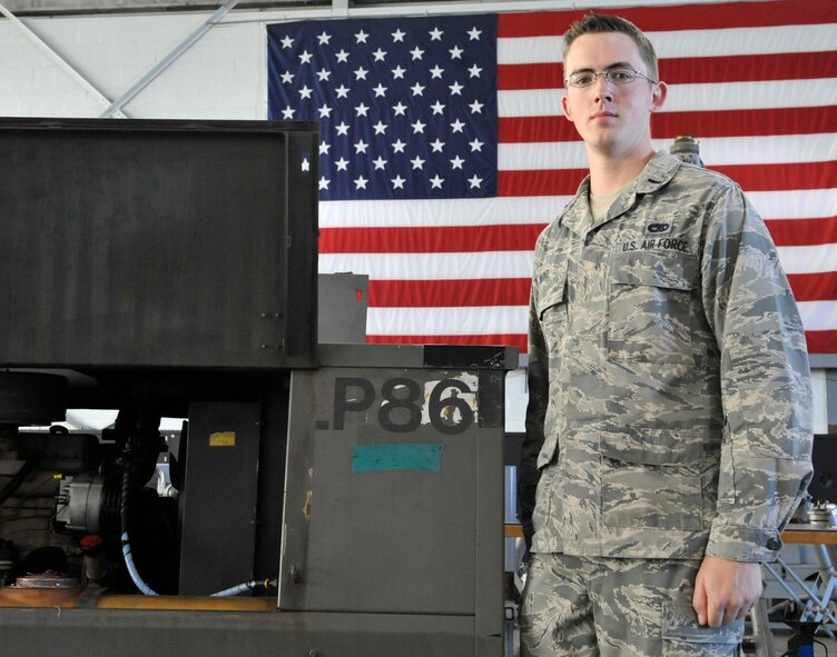 1st Lt. Joshua Bedel, 2nd Maintenance Squadron Aerospace Ground Equipment Flight officer in-charge, stands in front of a piece of AGE at his work center Oct. 8, 2013, on Barksdale Air Force Base, La. Bedel recently finished a short internship that he helped develop at the Organization for Security and Cooperation in Europe. He encourages Airmen to find unique opportunities to develop themselves personally and professionally beyond college and volunteering. (U.S. Air Force photo/Tech. Sgt. Mike Andriacco)