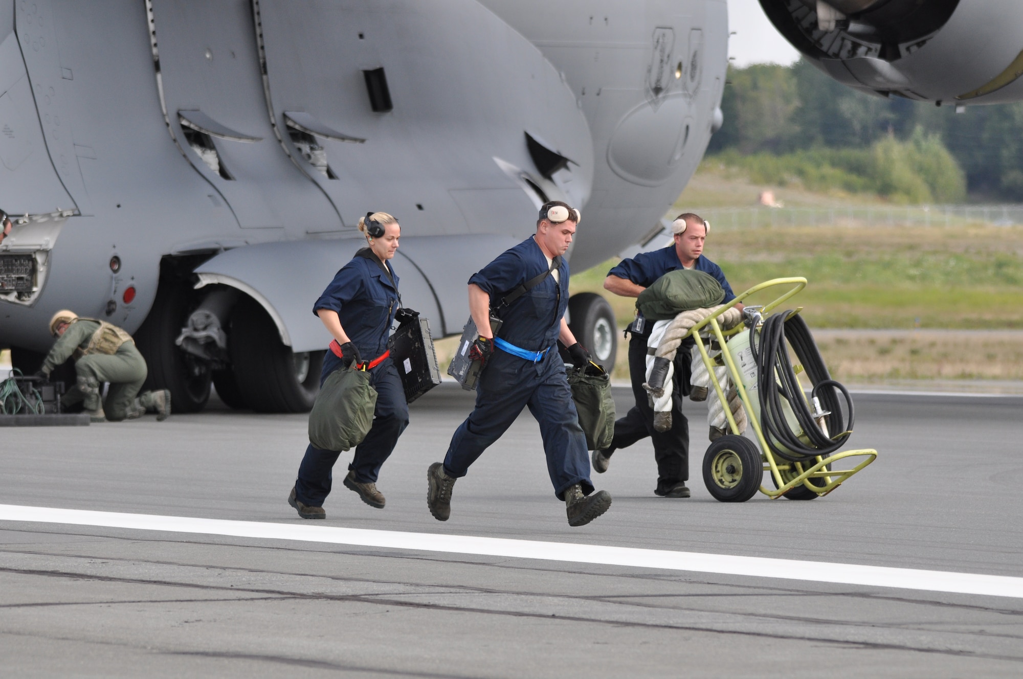 Maintainers from the 3rd Aircraft Maintenance Squadron hustle into place before the arrive of the F-22 here recently. The newest strategy in fighter employment will enable combat-ready F-22’s to rapidly refuel, rearm, and redeploy in record time was demonstrated here during joint exercises in August.  The new concept was developed by Lt. Col. Kevin Sutterfield, a Reserve F-22 pilot assigned to the 477th Fighter Group. (U.S. Air Force photo/Tech. Sgt. Dana Rosso) 
