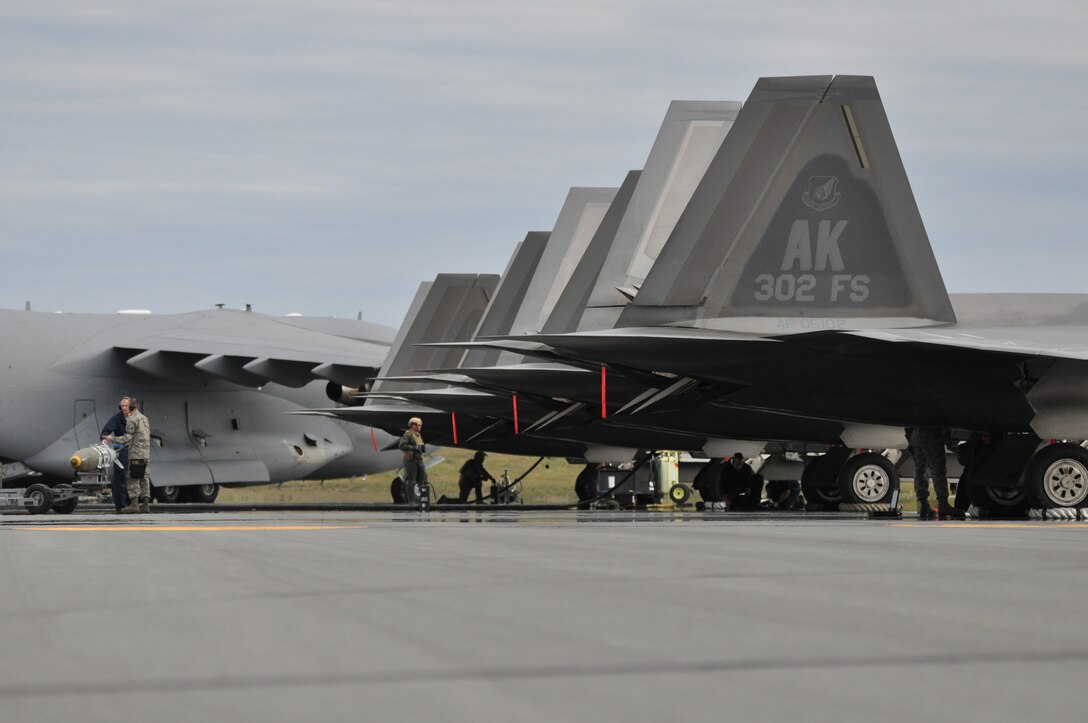 Fuels Specialist refuel F-22 Raptors assigned to the 3rd Wing here recently. The newest strategy in fighter employment will enable combat-ready F-22’s to rapidly refuel, rearm, and redeploy in record time was demonstrated here during joint exercises in August.  The new concept was developed by Lt. Col. Kevin Sutterfield, a Reserve F-22 pilot assigned to the 477th Fighter Group. (U.S. Air Force photo/Tech. Sgt. Dana Rosso) 
