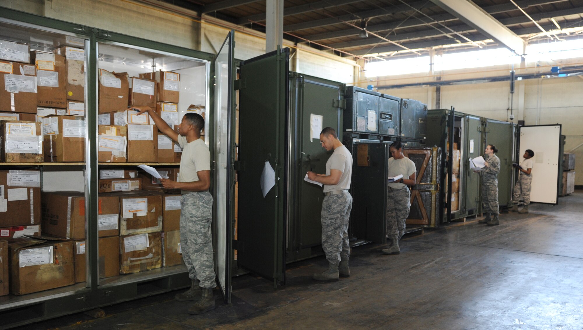 Airmen from the 2nd Logistics Readiness Squadron perform an inventory check for ISU-90 containers on Barksdale Air Force Base, La., Oct. 4, 2013. Each day, 2nd LRS Airmen ensure 100 percent accountability of all the 3,000 B-52H Stratofortress parts inside the warehouse. (U.S. Air Force photo/Senior Airman Joseph A. Pagán Jr.)