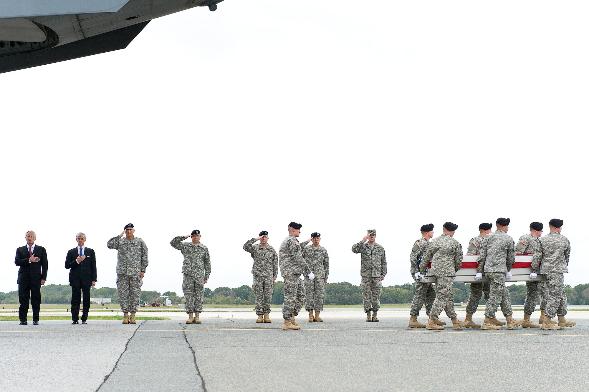 A U.S. Army carry team transfers the remains of Army Pfc. Cody J. Patterson of Philomath, Ore., Oct. 9, 2013 at Dover Air Force Base, Del. Patterson was assigned to the 3rd Battalion, 75th Ranger Regiment, Fort Benning, Ga. (U.S. Air Force photo/Roland Balik)