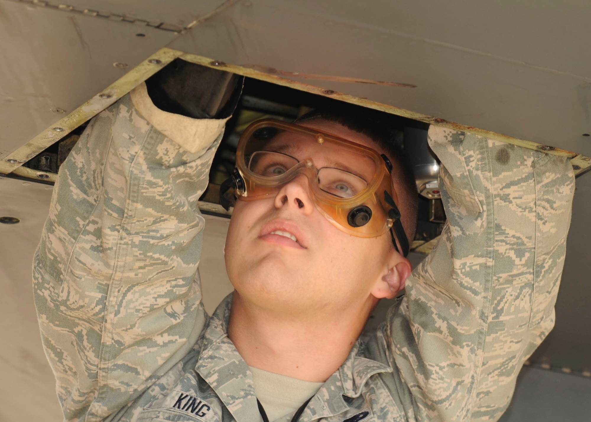 Airman 1st Class Andrew King, 2nd Aircraft Maintenance Squadron crew chief, works on hydraulics for a B-52H Stratofortress on Barksdale Air Force Base, La., Oct. 8, 2013. The hydraulic systems of the B-52H Stratofortress allow the aircraft to steer, land and maneuver through the battlefield..  (U.S. Air Force photo/Senior Airman Kristin High)