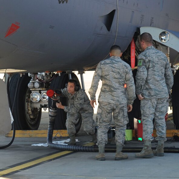 Airmen from 2nd Aircraft Maintenance Squadron watch as Airman 1st Class Samuel Amatrudi, 2nd AMXS crew chief, hooks a single-point refuel hose to a B-52H Stratofortress on Barksdale Air Force Base, La., Oct. 8, 2013. The use of aerial refueling gives the B-52 a range limited only by crew endurance. It has an unrefueled combat range in excess of 8,800 miles. (U.S. Air Force photo/Senior Airman Kristin High)