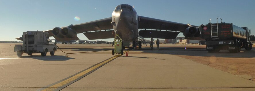Airmen from 2nd Logistics Readiness Squadron assist 2nd Aircraft Maintenance Squadron Airmen with refueling a B-52H Stratofortress on Barksdale Air Force Base, La., Oct. 8, 2013. The B-52 is capable of flying at high subsonic speeds at altitudes up to 50,000 feet. (U.S. Air Force photo/Senior Airman Kristin High)