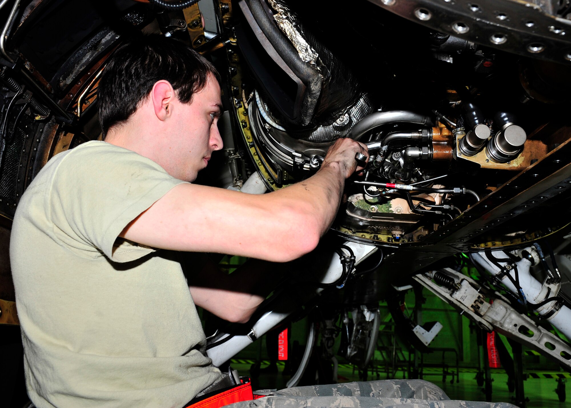 Senior Airman Cody Berry, 354th Maintenance Squadron crew chief, checks the jet fuel starter of an F-16 Fighting Falcon Oct. 7, 2013, Eielson Air Force Base, Alaska. Berry and the rest of the phase shop will thoroughly inspect the 354th Fighter Wing’s flagship aircraft in an effort to keep the Aggressor jet flying in top condition. (U.S. Air Force photo by Senior Airman Ashley Nicole Taylor/Released)