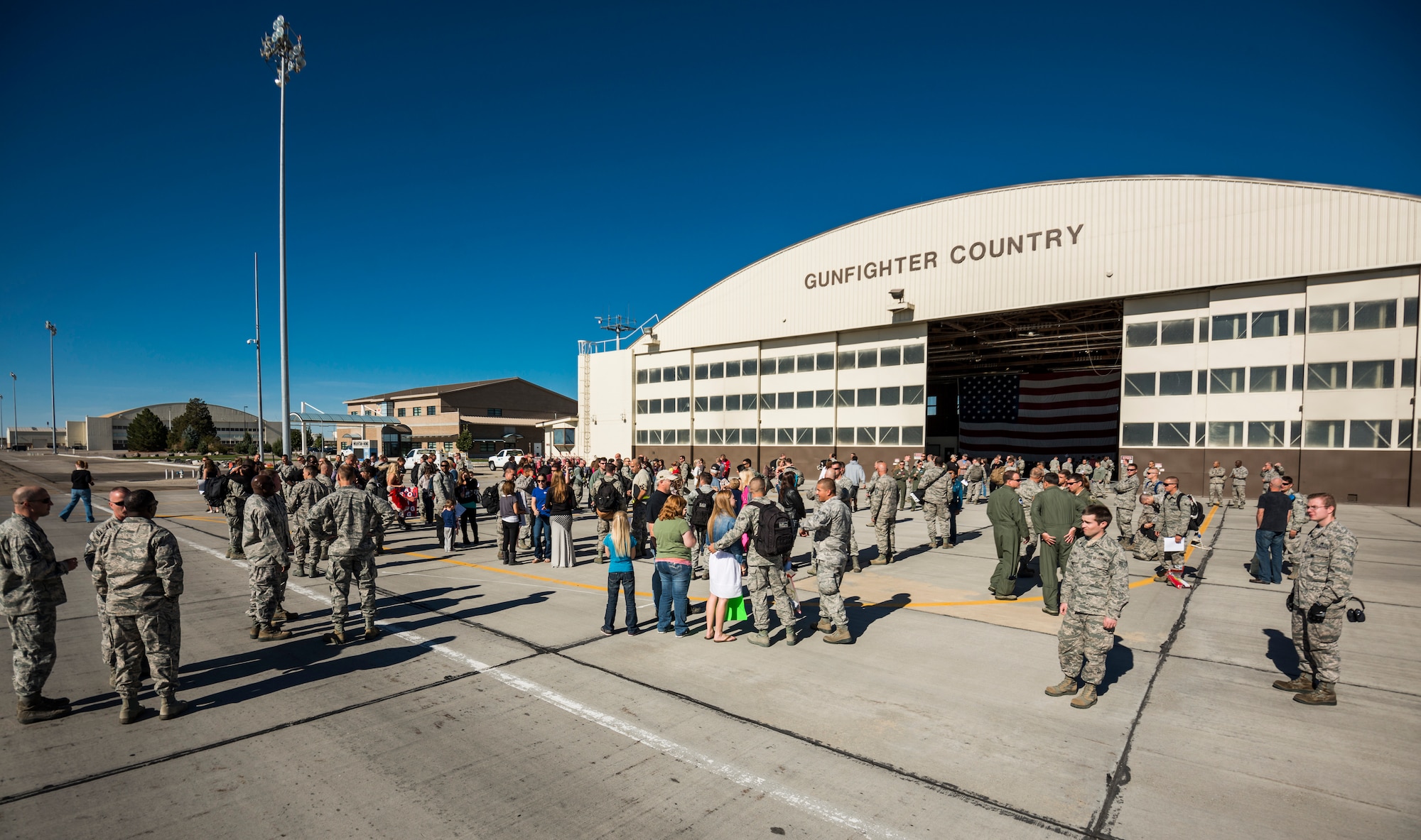 Friends and family of the 389th Fighter Squadron greet their loved ones at Mountain Home Air Force Base, Idaho, Oct. 5, 2013. The Airmen had deployed to Southwest Asia. (U.S. Air Force photo by Tech. Sgt. Samuel Morse/RELEASED)