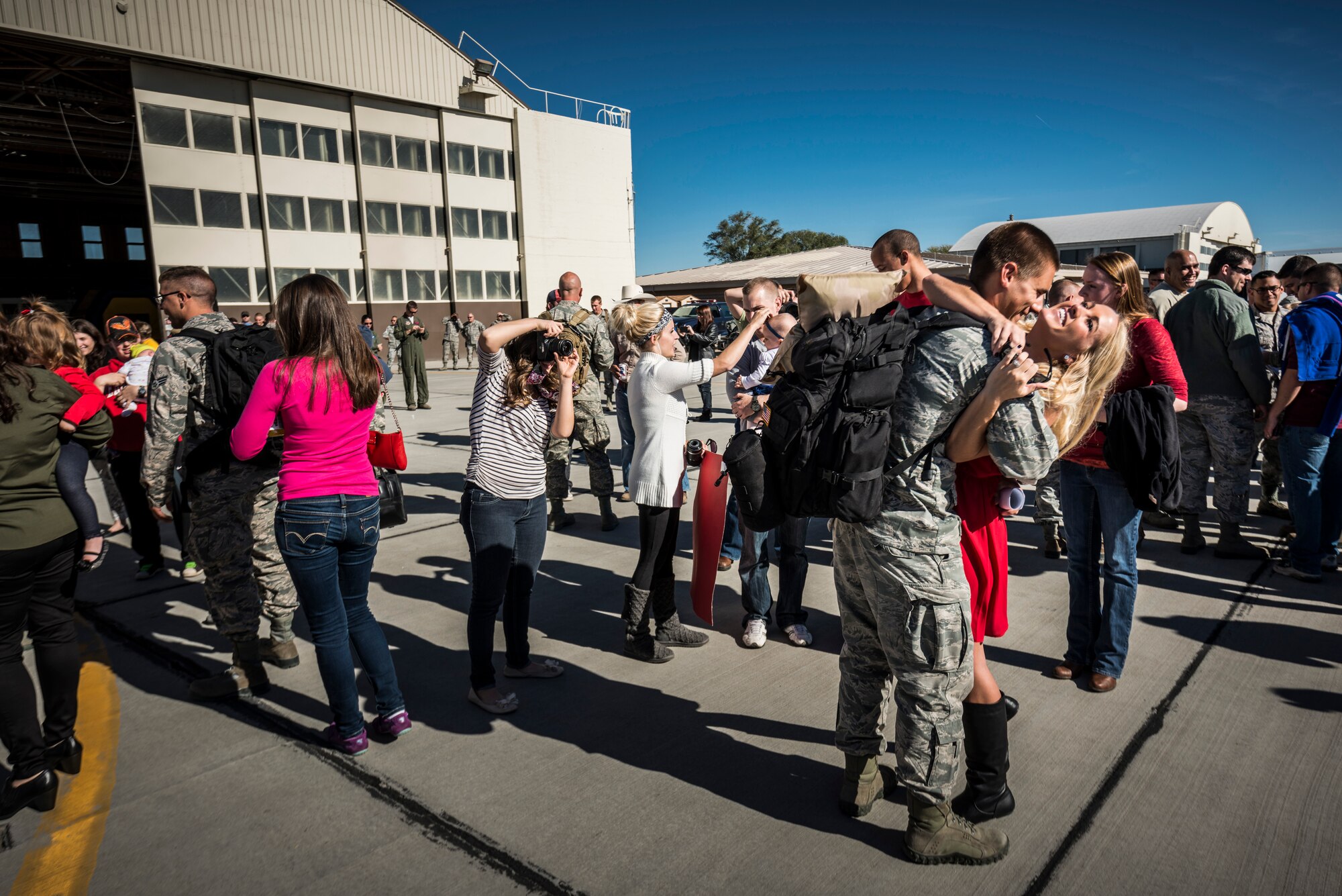 Friends and family of the 389th Fighter Squadron greet their loved ones at Mountain Home Air Force Base, Idaho, Oct. 5, 2013. The Airmen had deployed to Southwest Asia. (U.S. Air Force photo by Tech. Sgt. Samuel Morse/RELEASED)