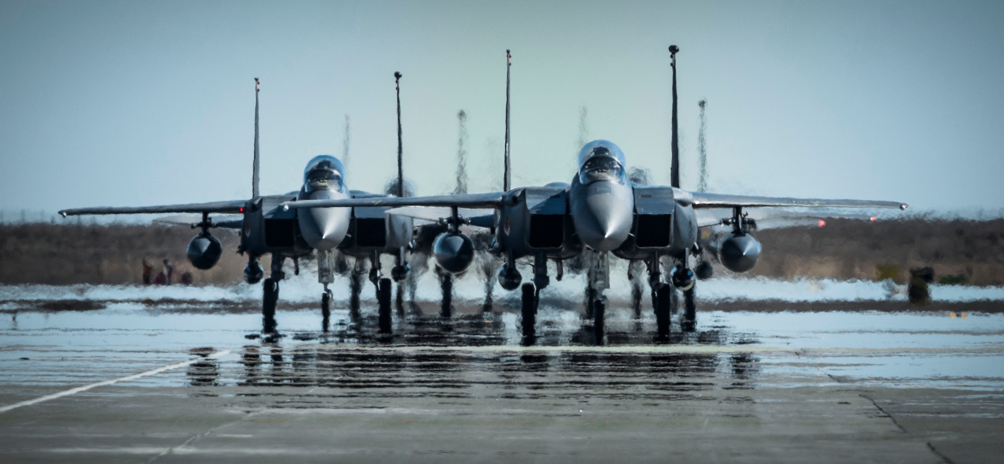 Returning U.S. Air Force F-15E Strike Eagles with the 389th Fighter Squadron taxi to their shelters at Mountain Home Air Force Base, Idaho, Oct. 5, 2013. The jets had returned from a deployment to Southwest Asia. (U.S. Air Force photo by Tech. Sgt. Samuel Morse/RELEASED)