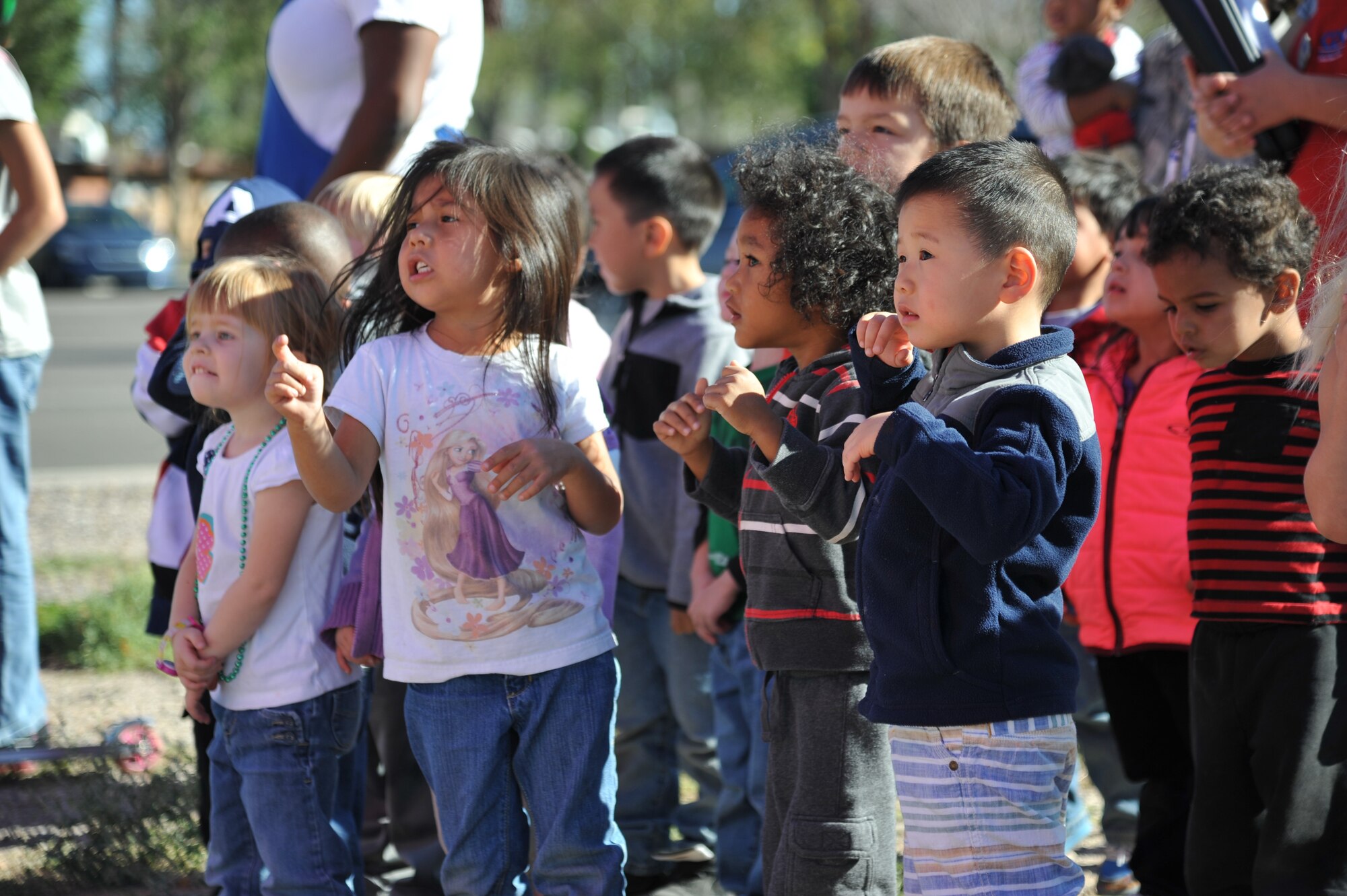 Children from Kirtland's Child Development Center look in wonderment at Nelly-B, a balloon piloted by a crew from Belgium. Nelly-B and its team made a stop at the CDC Oct. 7 on its way to the Albuquerque International Balloon Fiesta.  (Photo by Ken Moore)