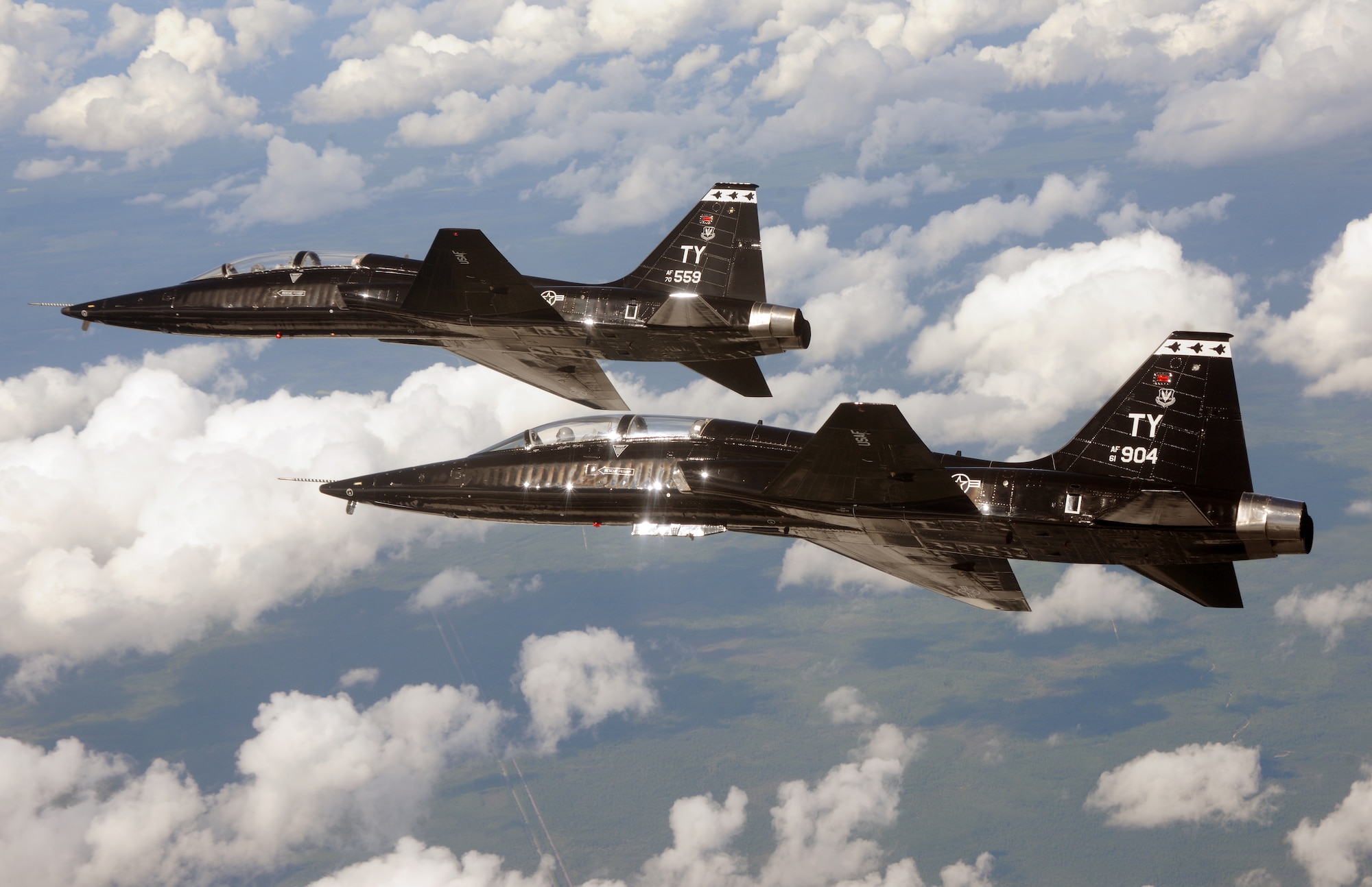 Two T-38 Talons fly above Tyndall Sept. 25. The T-38s are part of 325th Training Support Squadron and are an integral part in the training of new F-22 Raptor pilot students. They act as adversaries in simulated air-to-air combat missions. (U.S. Air Force photo by Master Sgt. J S. Wilcox)