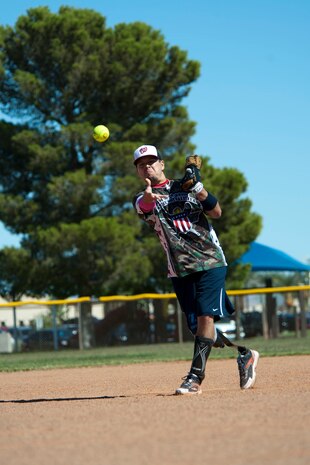 Michael Dreyer , Wounded Warrior Amputee Softball Team member, pitches the ball during a game against Nellis and Creech Air Force Bases’ Airmen at the baseball field at Freedom Park Oct. 5, 2013, at Nellis AFB, Nev. The WWAST is comprised of veterans and active-duty members who have lost limbs post 9/11 while serving in the military. (U.S. Air Force photo by Airman 1st Class Timothy Young)