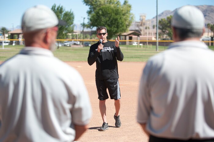 Col. Barry Cornish, 99th Air Base Wing commander, provides opening remarks prior to a Wounded Warrior softball game at the baseball field at Freedom Park Oct. 5, 2013, at Nellis Air Force Base, Nev. The Wounded Warrior Amputee Softball Team played against Airmen from Nellis and Creech AFBs during a double header. The WWAST roster is comprised of veterans who have undergone an amputation or multiple amputations while serving in the military after 9/11. (U.S. Air Force photo by Staff Sgt. Christopher Hubenthal)