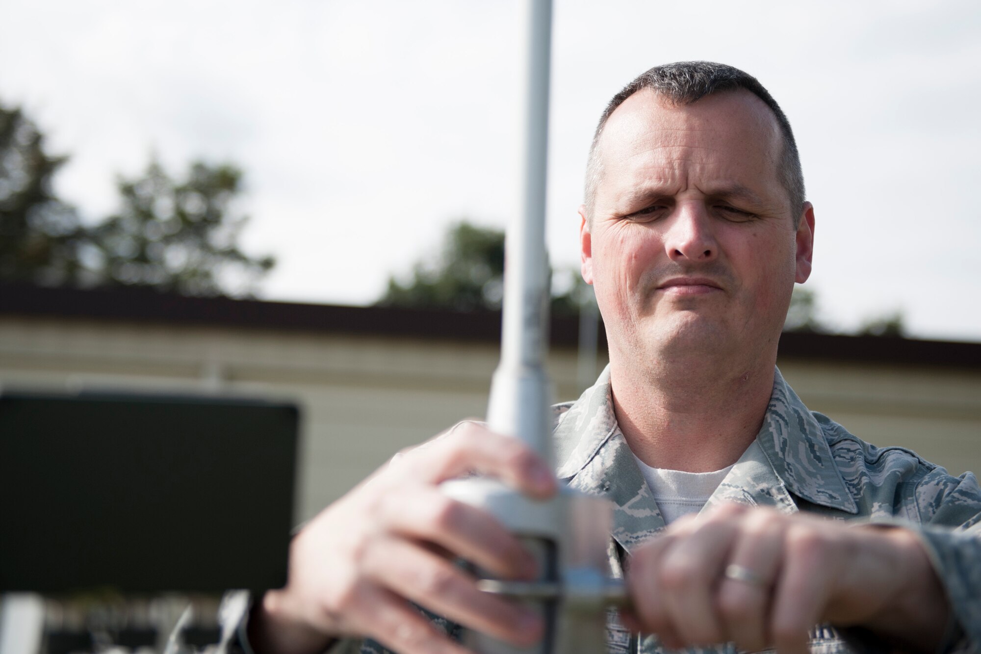Master Sgt. Phillip Whitworth, 352nd Special Operation Support Squadron Weather Flight chief, sets up a weather balloon receiver station at RAF Mildenhall, England, Sept. 18, 2013. The 352nd SOSS Weather Flight provides accurate and timely weather information in support of the 352nd Special Operations Group. (U.S. Air Force photo by Staff Sgt. Stephen Linch)
