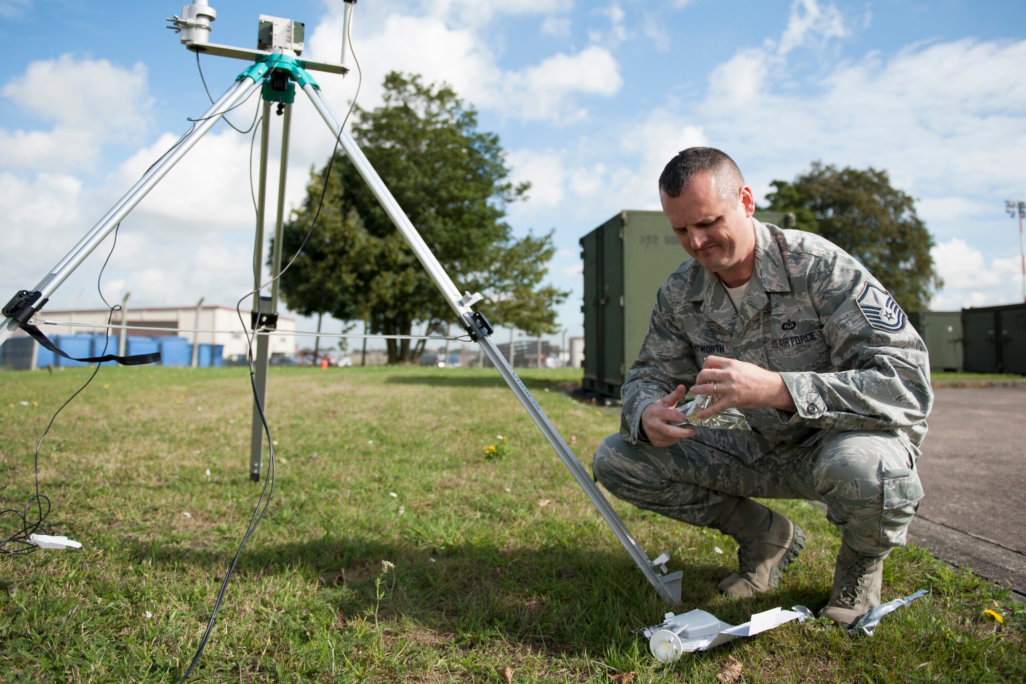 Master Sgt. Phillip Whitworth, 352nd Special Operation Support Squadron Weather Flight chief, prepares a radio before attaching it to a weather balloon at RAF Mildenhall, England, Sept. 18, 2013. The 352nd SOSS Weather Flight uses weather balloons to gather atmospheric data such as temperature, humidity and wind speed. (U.S. Air Force photo by Staff Sgt. Stephen Linch)
