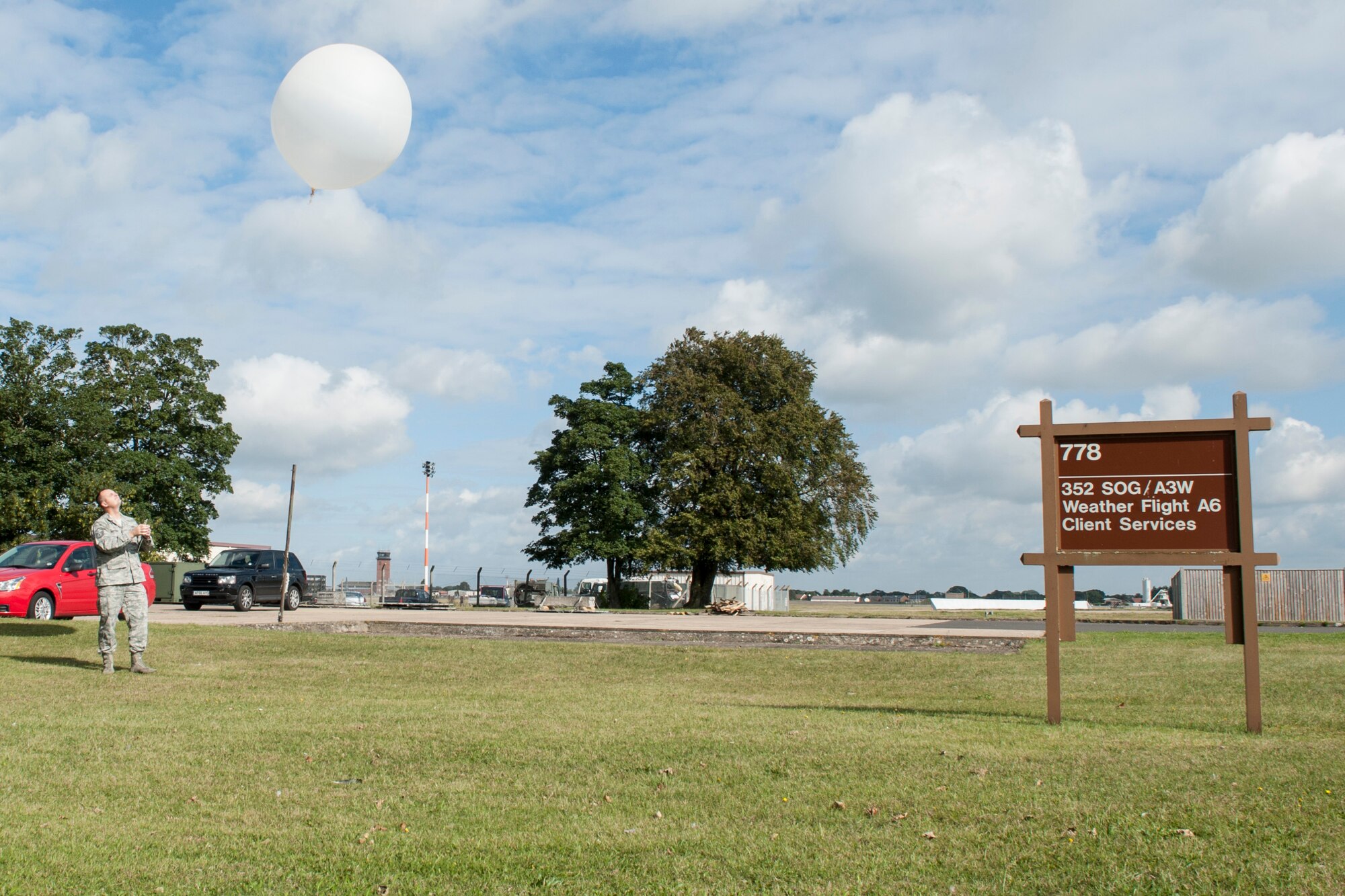 Master Sgt. Phillip Whitworth, 352nd Special Operation Support Squadron Weather Flight chief, watches a weather balloon after releasing it at RAF Mildenhall, England, Sept. 18, 2013. The 352nd SOSS Weather Flight uses weather balloons to gather atmospheric data such as temperature, humidity and wind speed. (U.S. Air Force photo by Staff Sgt. Stephen Linch)
