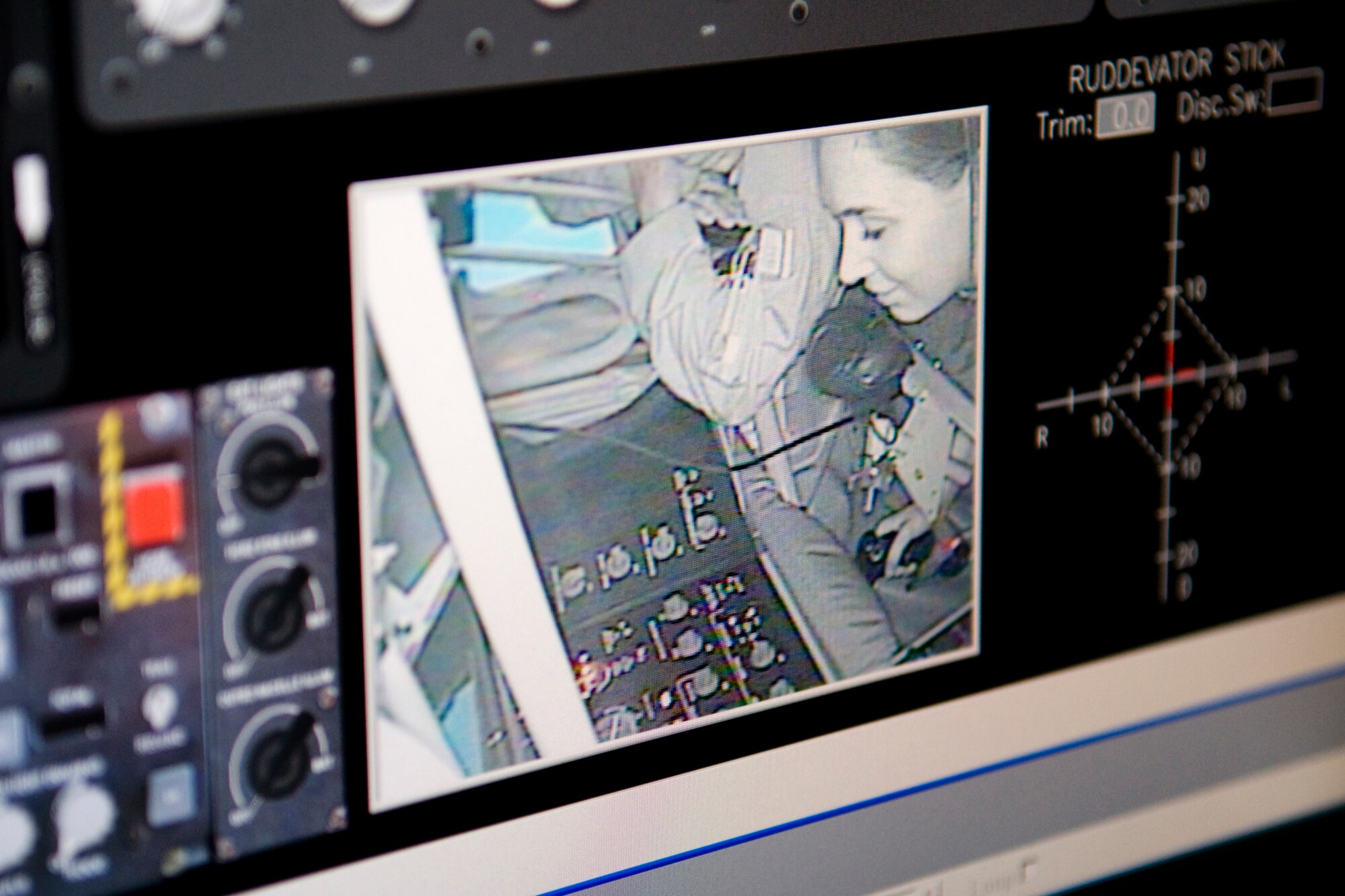 Meredith Perks, a regional director for Sen. Joe Donnelly, is seen in a control screen of a new boom operator weapons system trainer at Grissom Air Reserve Base, Ind., as she takes her shot in making a connection with an F-22 Raptor Sept. 27, 2013. Grissom's BOWST, which cost approximately $3 million, will provide significant benefits by reducing the required number of flight hours in a KC-135 Stratotanker for boom operators to maintain training and currency. (U.S. Air Force photo/Tech. Sgt. Mark R. W. Orders-Woempner) 
