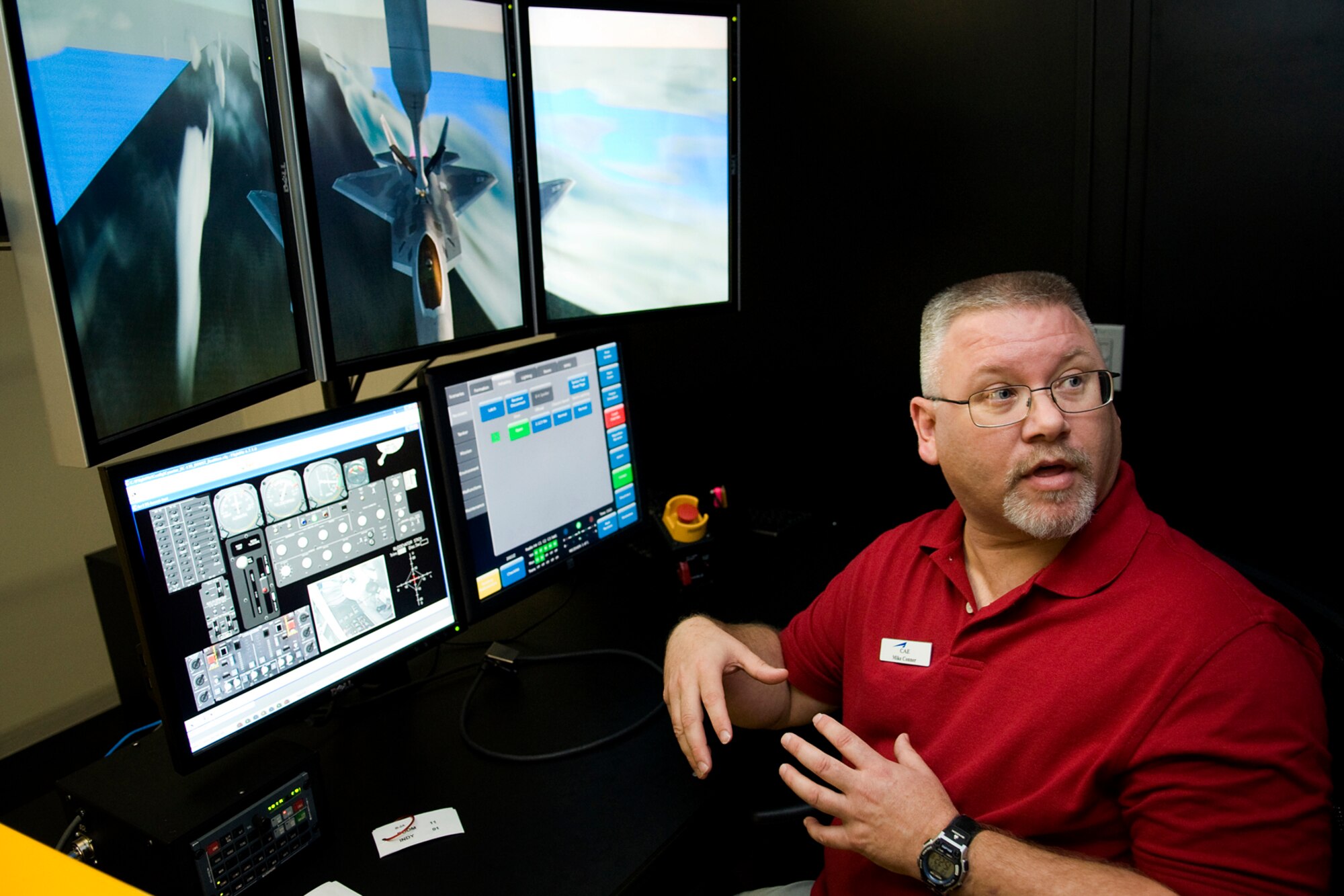 Mike Conner, a contract trainer for a new boom operator weapons system trainer at Grissom Air Reserve Base, Ind., explains the technical aspects of a BOWST to members of the Grissom Community Council Sept. 27, 2013. According to initial Air Force projections, the reduction in flight training will save Grissom an estimated $3 million per year. (U.S. Air Force photo/Tech. Sgt. Mark R. W. Orders-Woempner) 
