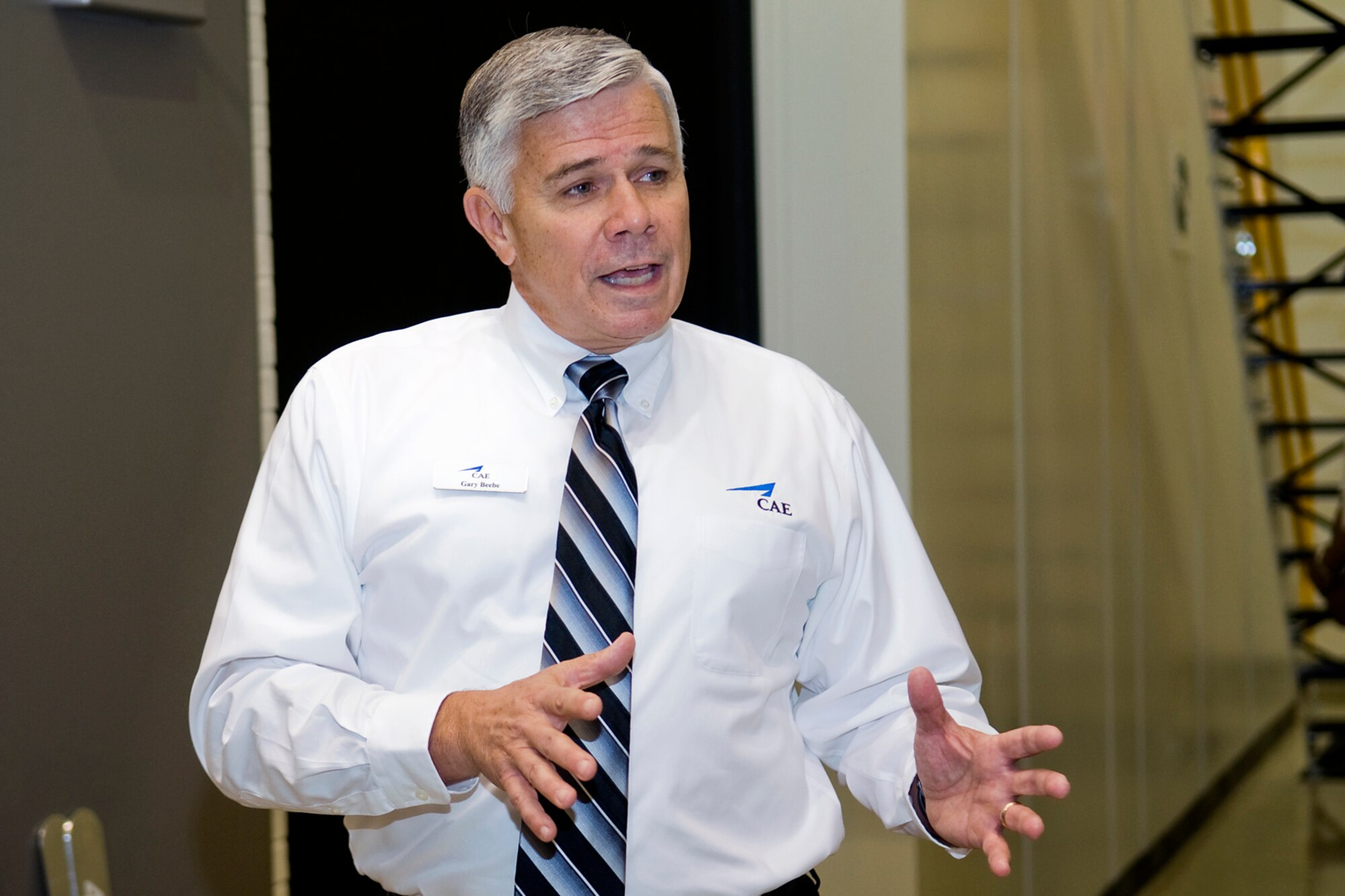Gary Beebe, a contract site manager for a new boom operator weapons system trainer at Grissom Air Reserve Base, Ind., explains the benefits the BOWST provides during a ribbon-cutting ceremony Sept. 27, 2013. Grissom is the first Air Force Reserve Command base to have a BOWST, which will allow KC-135 Stratotanker boom operators to conduct vital training in a virtual environment. (U.S. Air Force photo/Tech. Sgt. Mark R. W. Orders-Woempner) 
